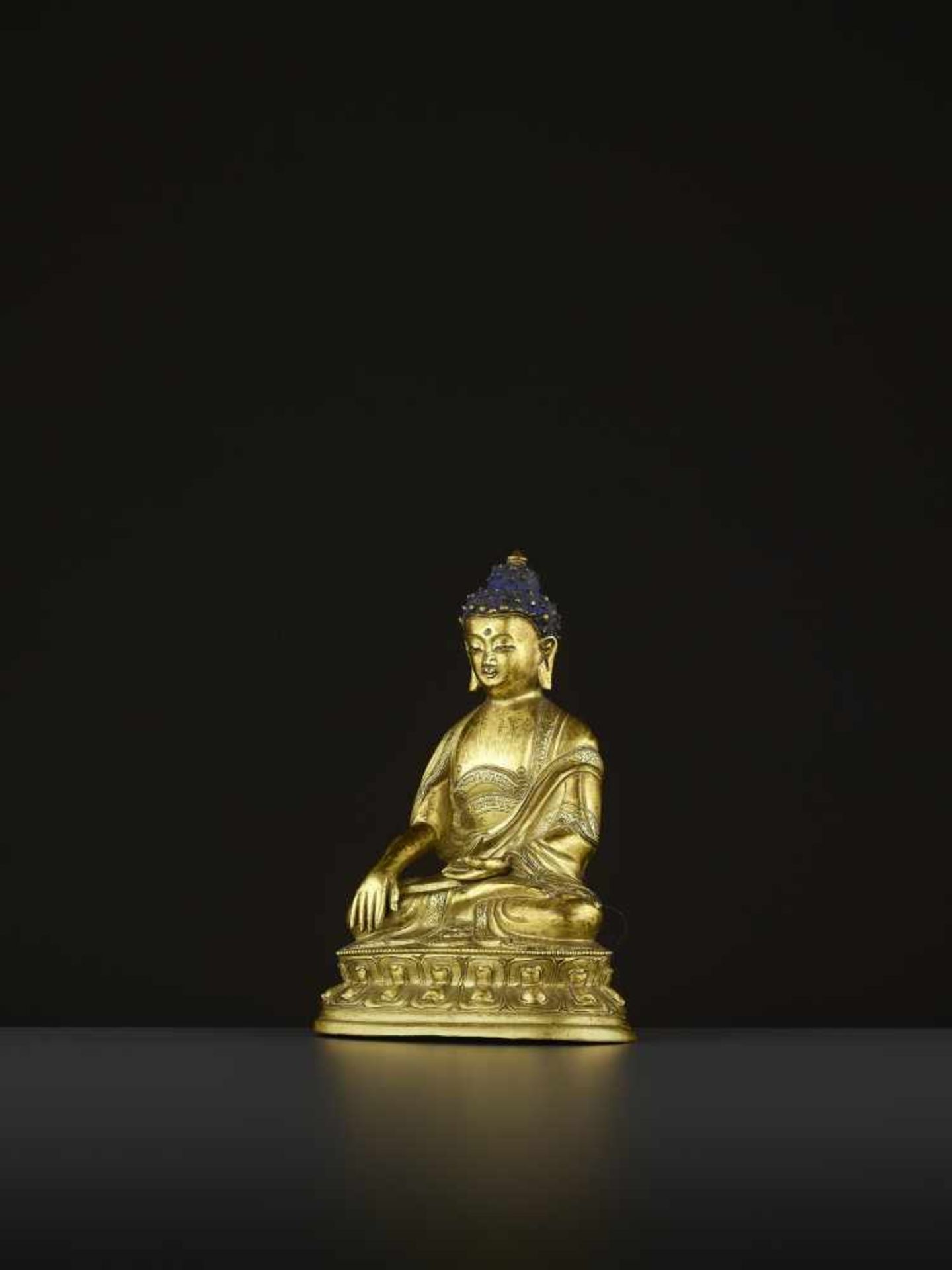 A GILT COPPER-ALLOY BUDDHA, QING China, 18th-19th century. The majestic deity is well cast seated in - Image 2 of 8