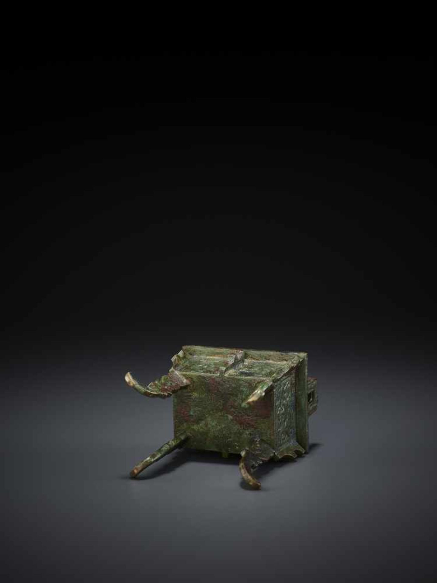 A MINIATURE BRONZE MODEL OF A FANGDING China, Qing dynasty. The miniaturized ritual food vessel - Image 8 of 10