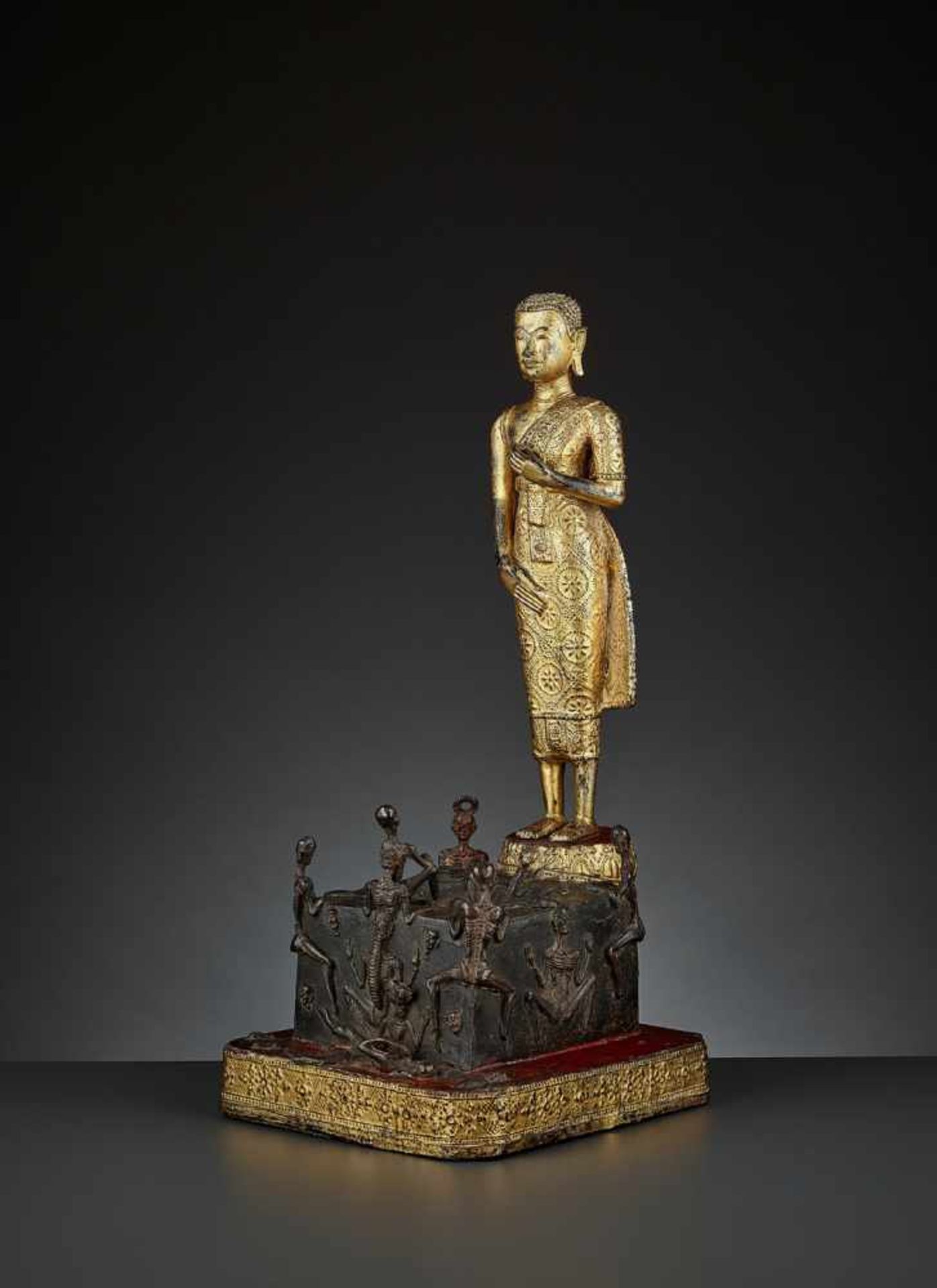 BUDDHA AND THE WELL OF DOOM Thailand, Ratanakosin, 19th century. A massive gilt and lacquered bronze