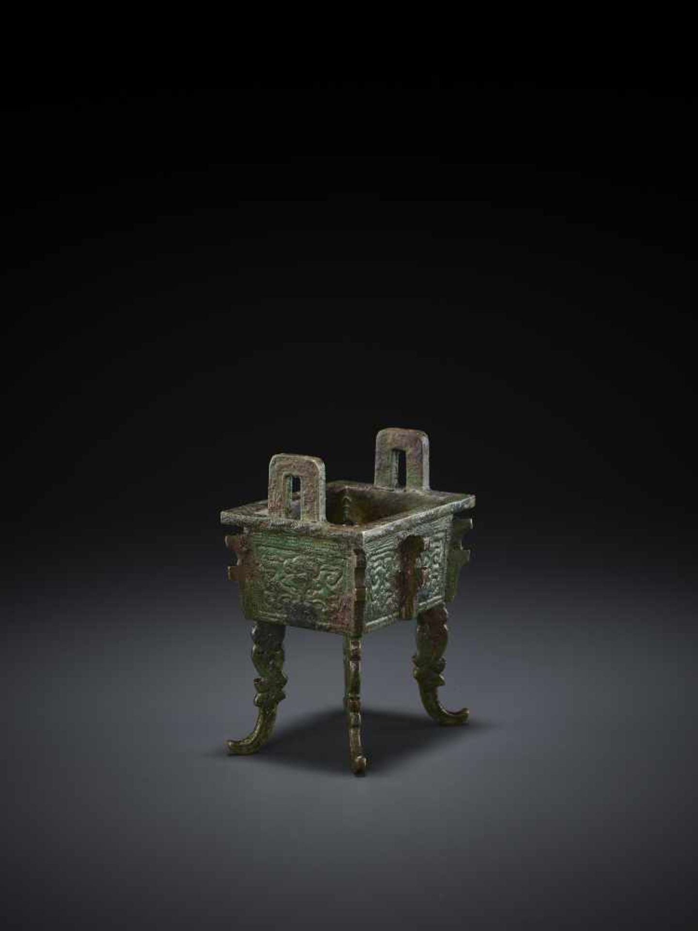 A MINIATURE BRONZE MODEL OF A FANGDING China, Qing dynasty. The miniaturized ritual food vessel - Image 9 of 10