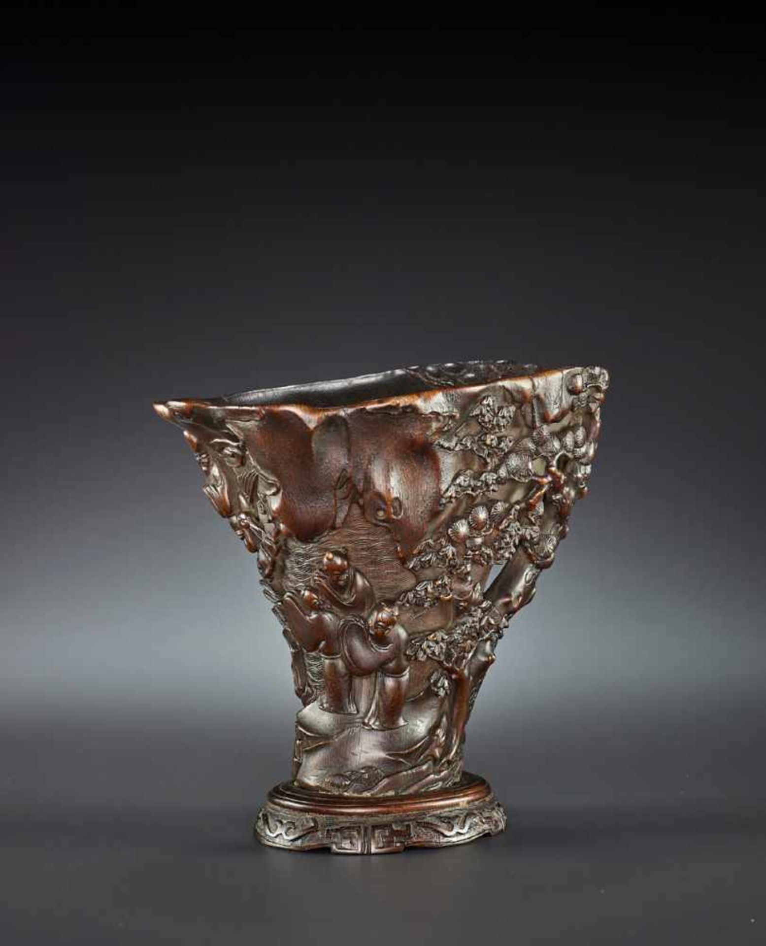 A LARGE RHINOCEROS HORN LIBATION CUP China, 17th – early 18th century. Finely carved in high