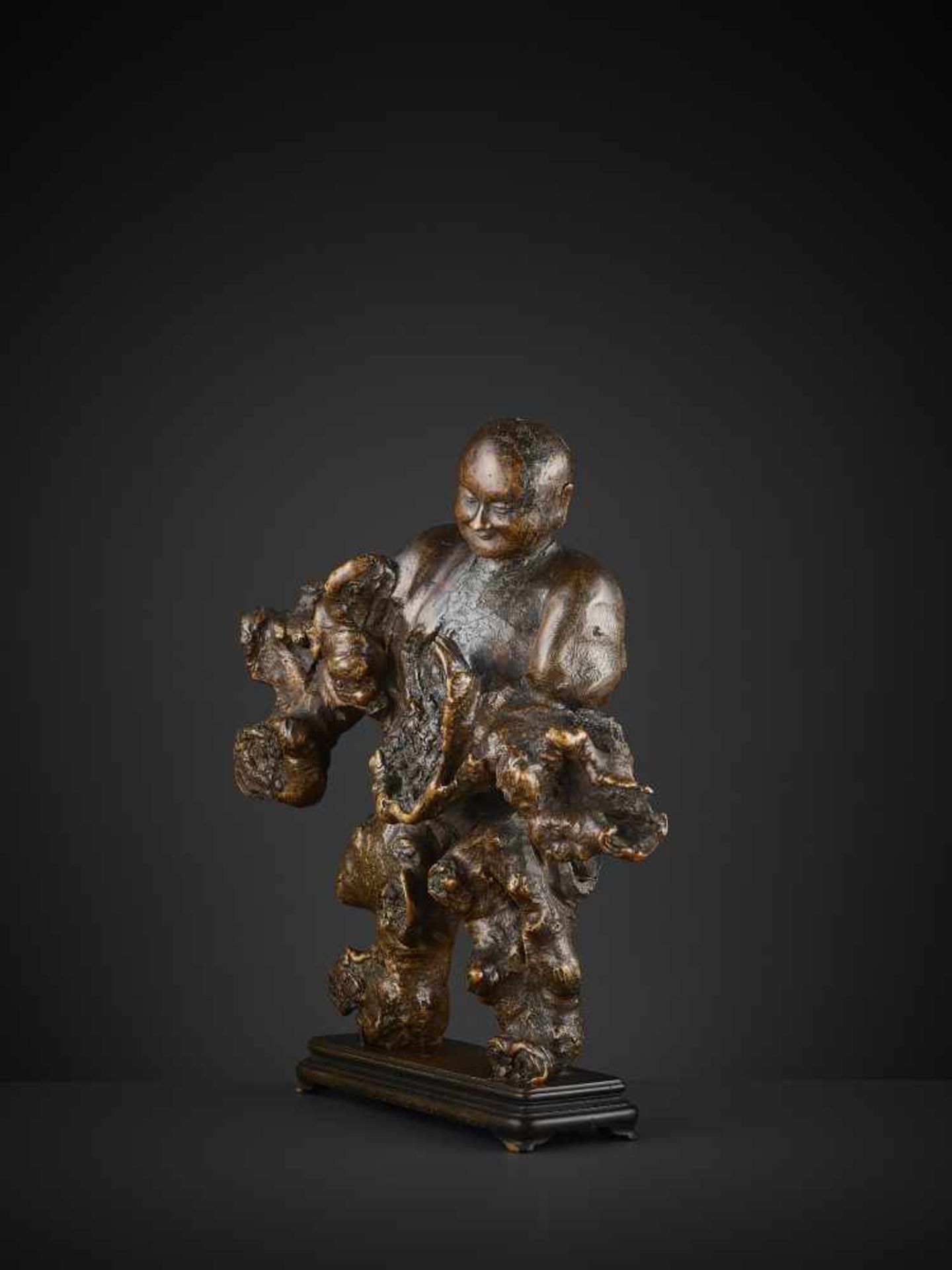 A BURLWOOD CARVING OF A LUOHAN China, 17th - 18th century. Carved in a standing position, using - Image 4 of 10