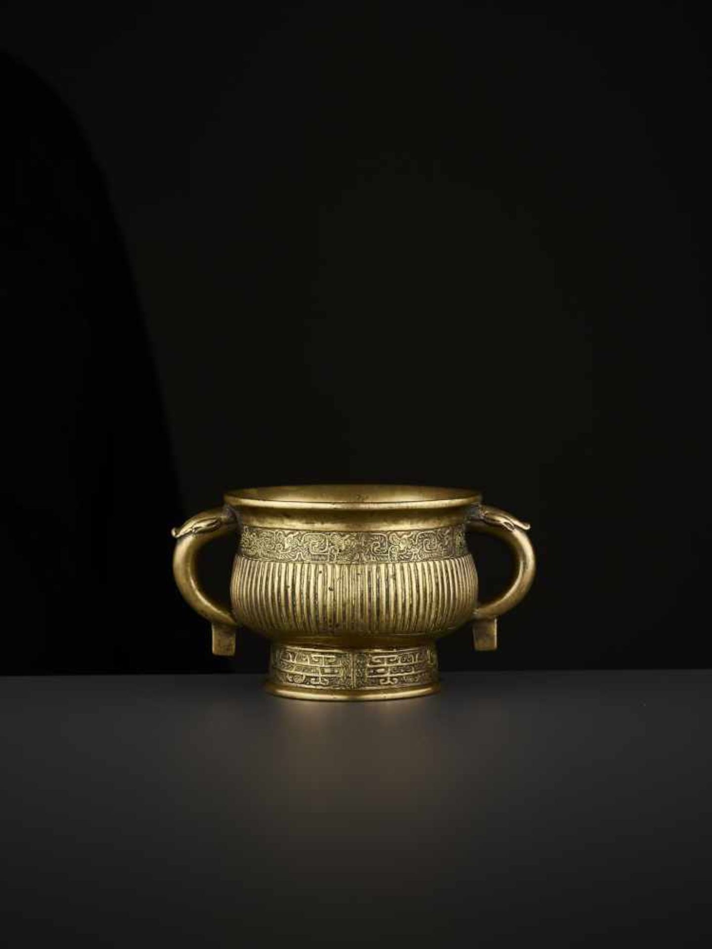 AN ARCHAISTIC BRONZE CENSER, QING China, 18th-19th century. The vessel with two circumferential