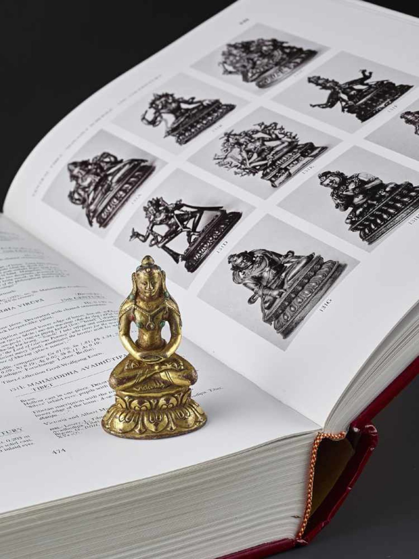 A GILT BRONZE MAHASIDDHA VIRUPA, 16TH CENTURY Tibet. Seated in dhyanasana on a double lotus base, - Image 2 of 11