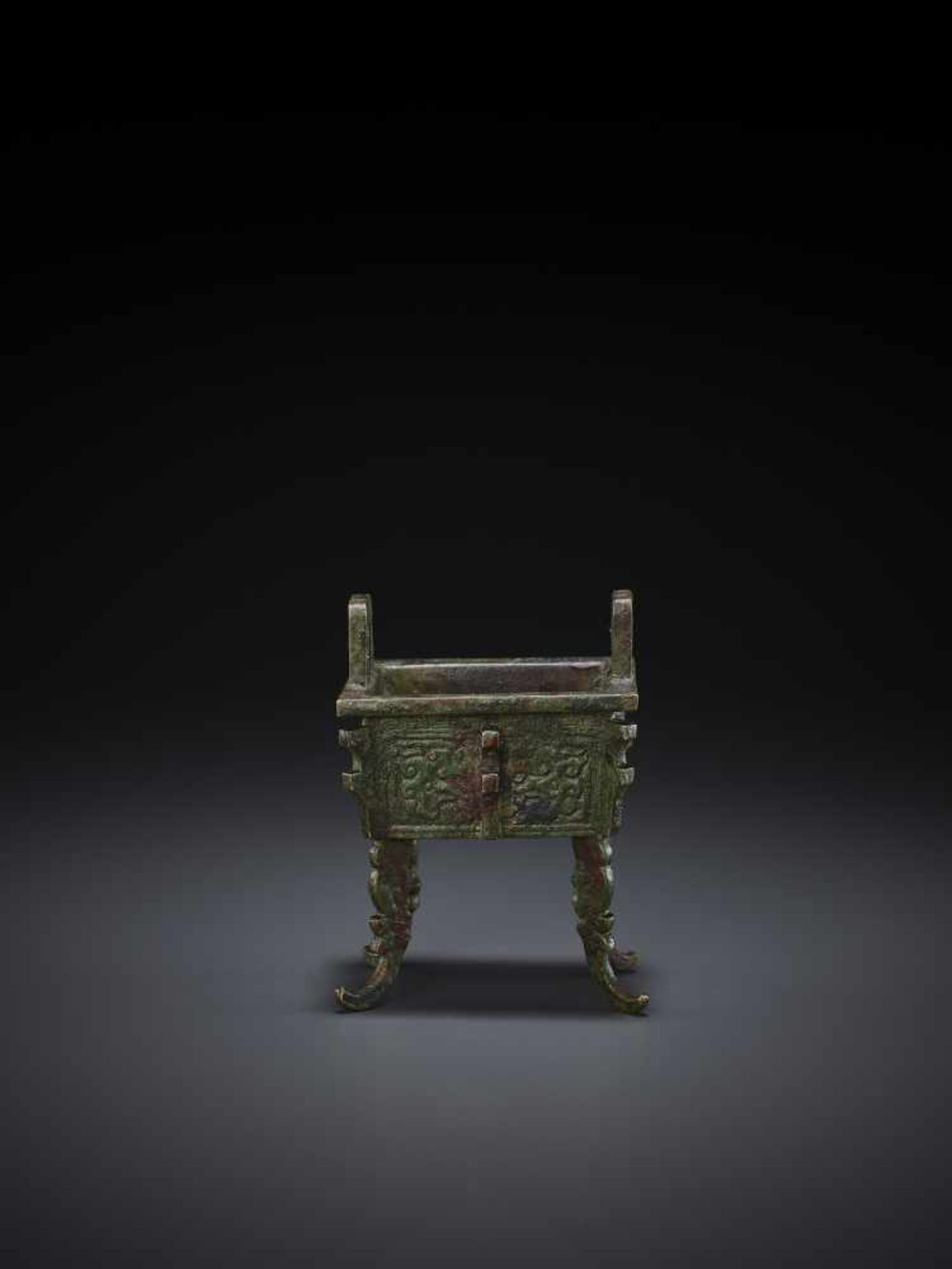 A MINIATURE BRONZE MODEL OF A FANGDING China, Qing dynasty. The miniaturized ritual food vessel - Image 3 of 10