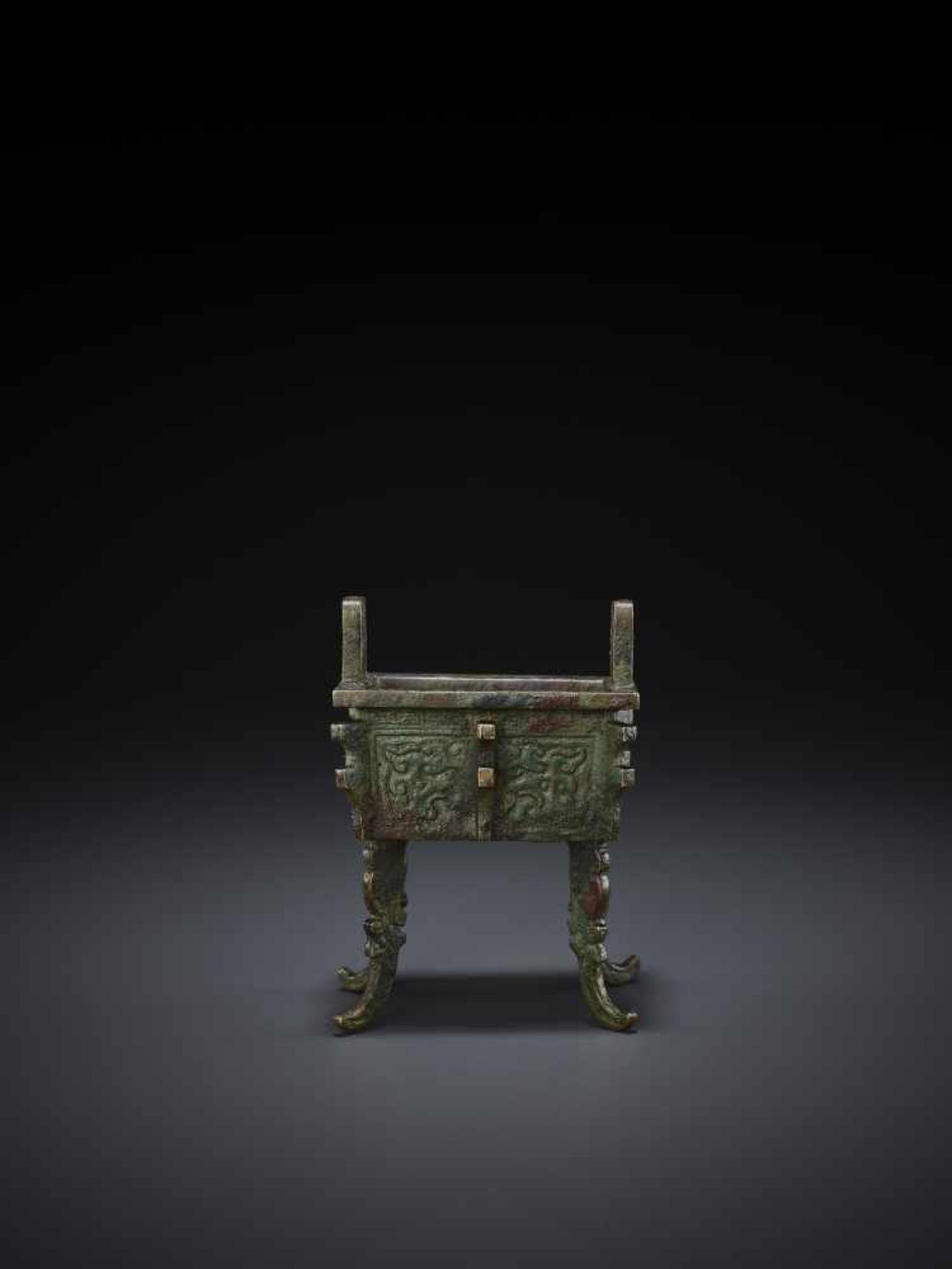 A MINIATURE BRONZE MODEL OF A FANGDING China, Qing dynasty. The miniaturized ritual food vessel - Image 6 of 10