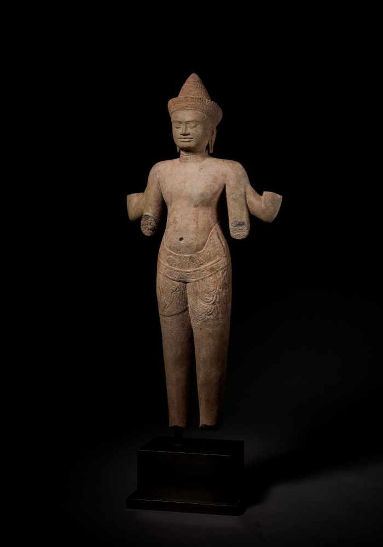 A STANDING VISHNU, BAPHUON, KHMER, 11TH CENTURY This important carved and incised sandstone