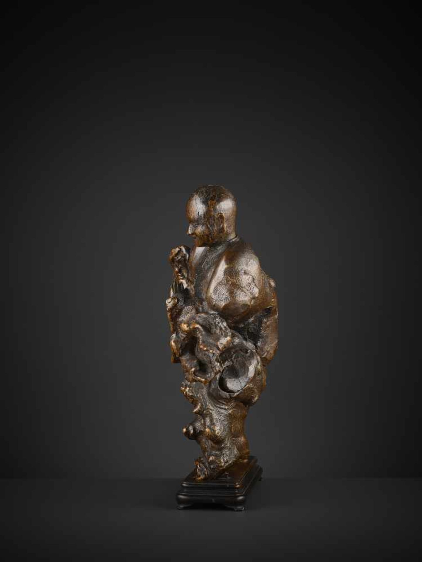 A BURLWOOD CARVING OF A LUOHAN China, 17th - 18th century. Carved in a standing position, using - Image 5 of 10