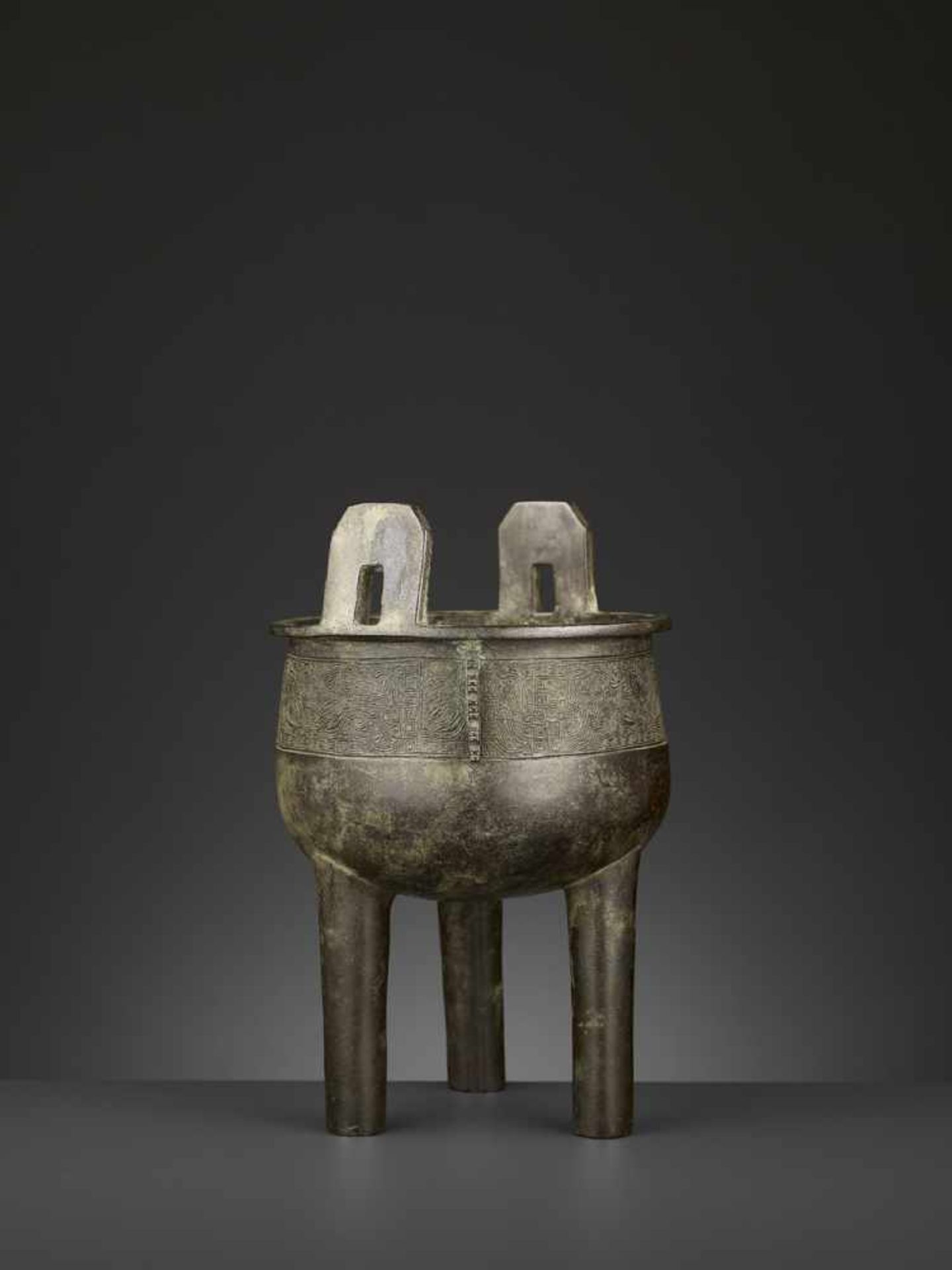 AN ARCHAISTIC BRONZE CENSER, DING China, 17th-18th century. The deep, bowl-shaped body supported - Image 9 of 10