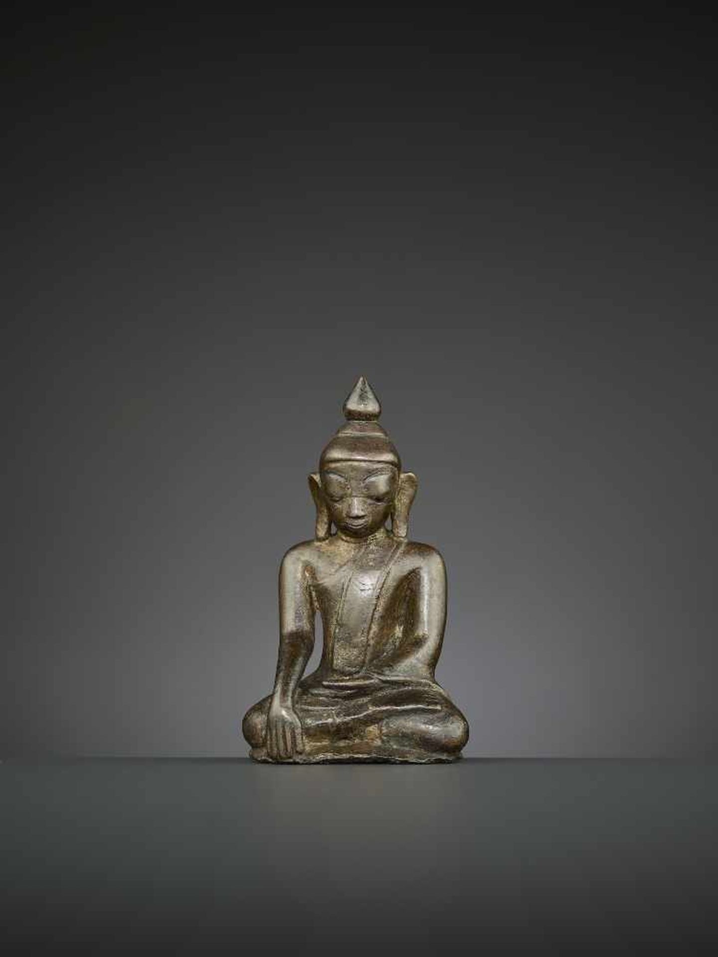 A BUDDHA BRONZE, BURMA, 14TH CENTURY The superbly cast statue depicting Shakyamuni seated in - Image 2 of 8