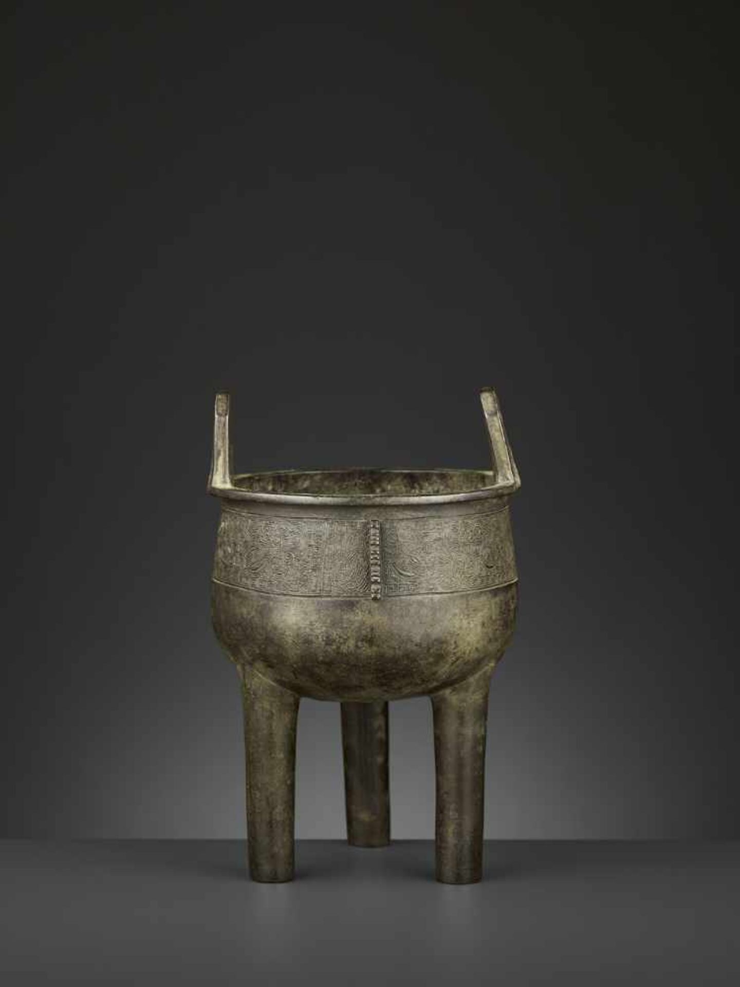 AN ARCHAISTIC BRONZE CENSER, DING China, 17th-18th century. The deep, bowl-shaped body supported - Image 5 of 10