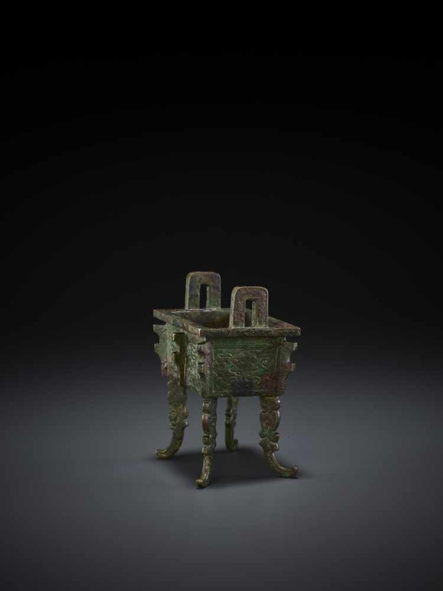 A MINIATURE BRONZE MODEL OF A FANGDING China, Qing dynasty. The miniaturized ritual food vessel - Image 10 of 10