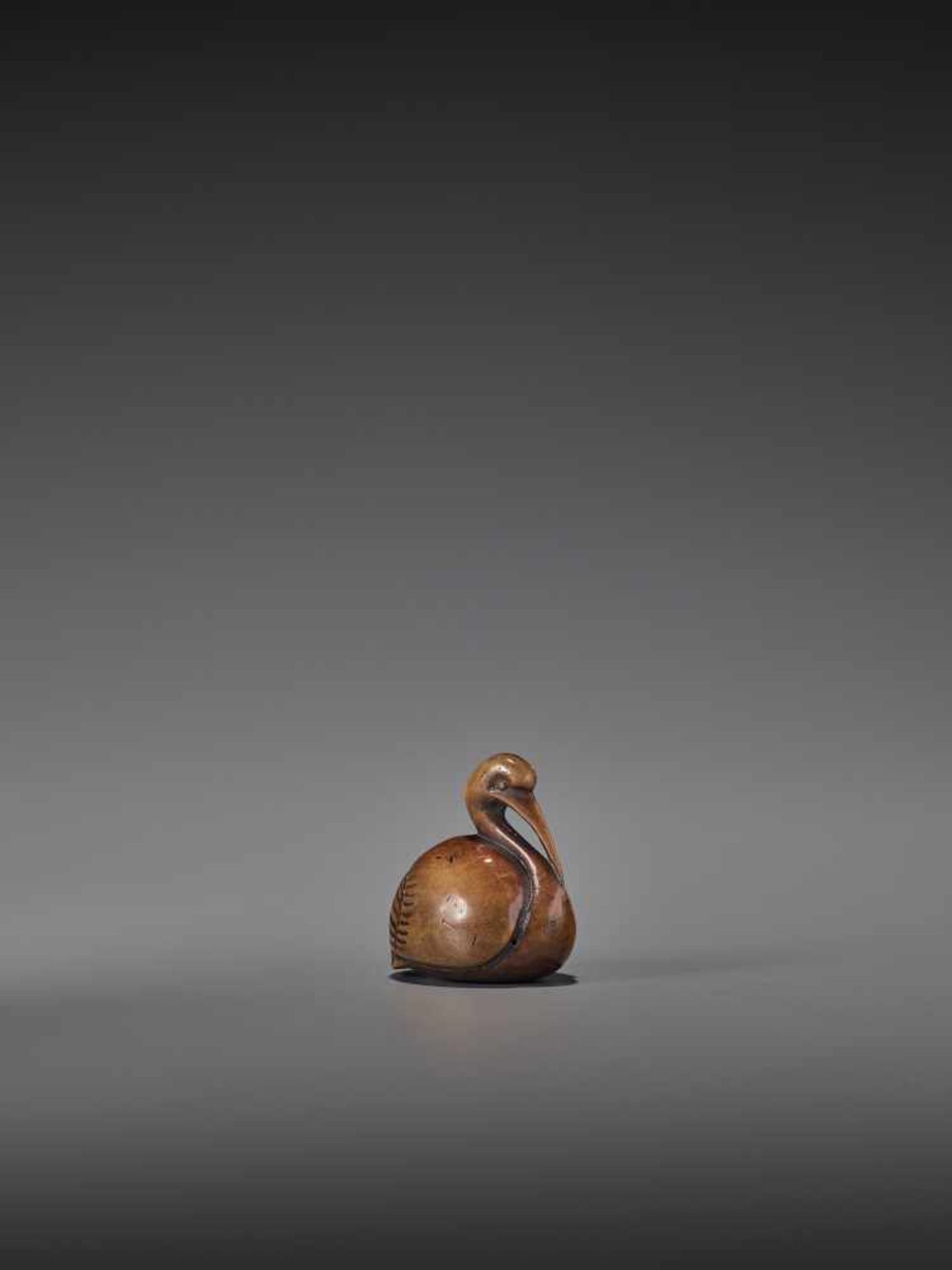 A RARE AND ELEGANT WOOD NETSUKE OF A CRANE UnsignedJapan, 18th century, Edo period (1615-1868)A wood - Image 5 of 8