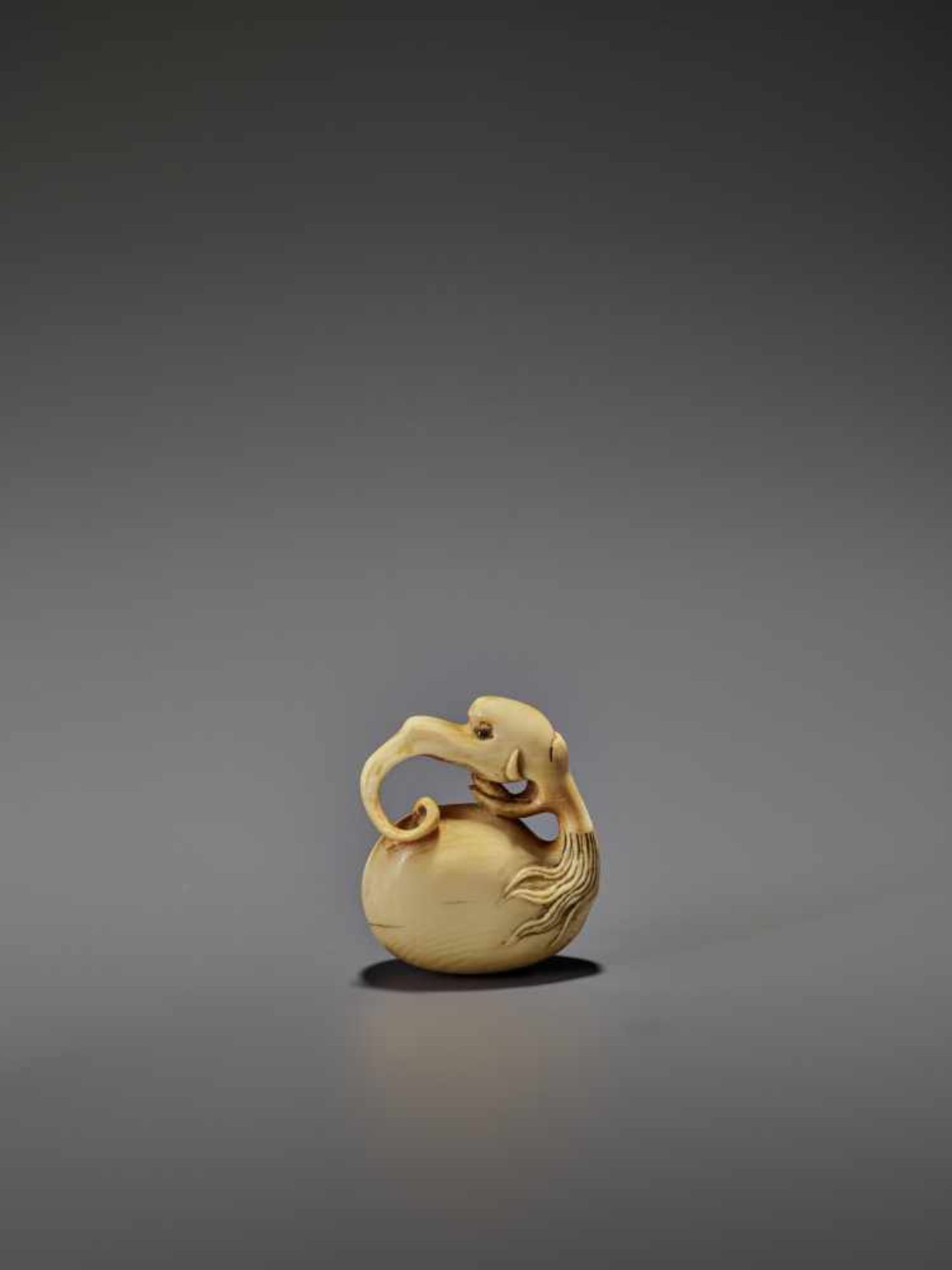 AN IVORY NETSUKE OF A BAKU HEADED MOKUGYO IN THE STYLE OF GYOKUMIN Unsigned, style of Gyokumin (