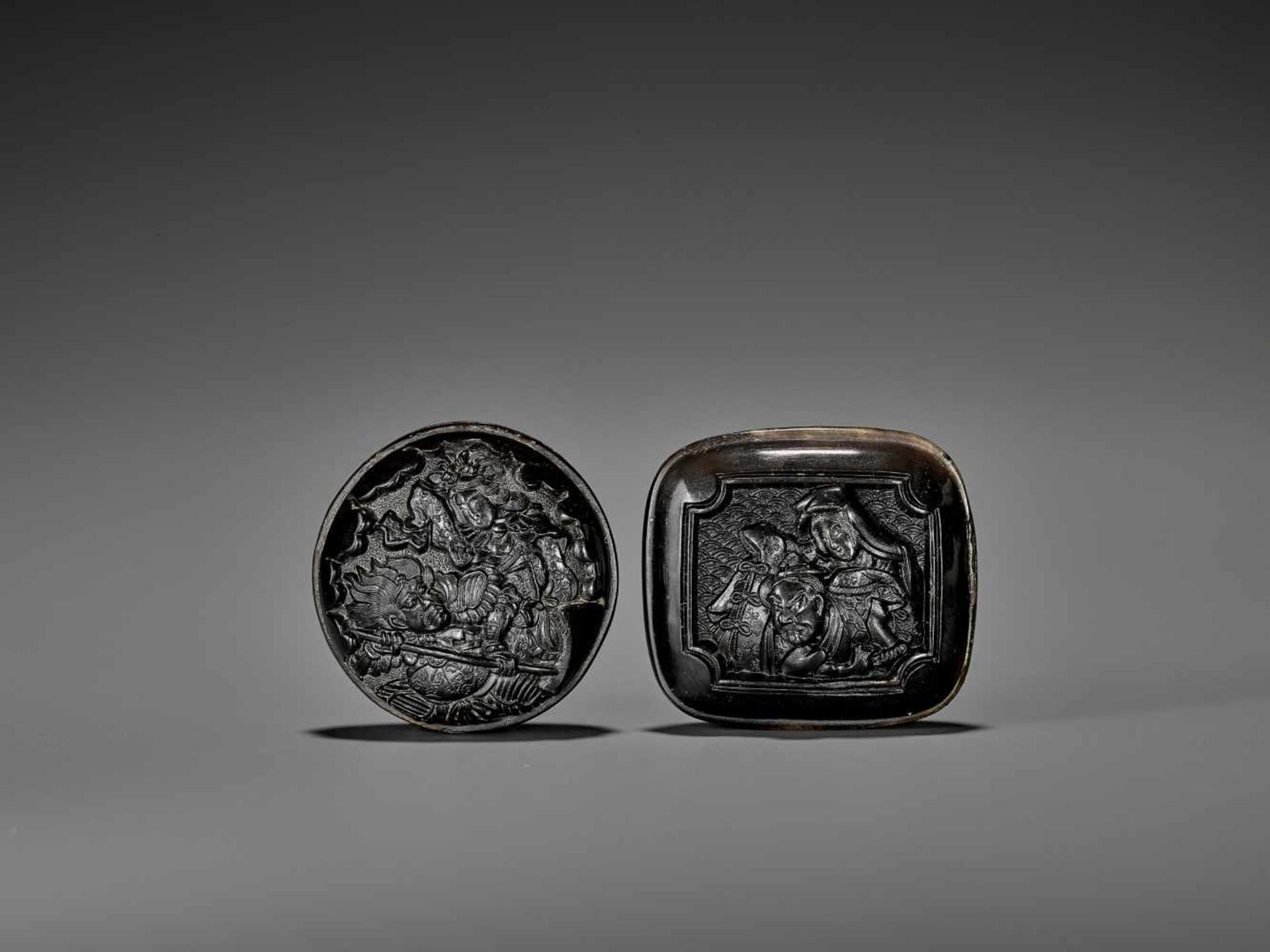 TWO FINE PRESSED HORN MANJU NETSUKE UnsignedJapan, 19th century, Edo period (1615-1868)The first