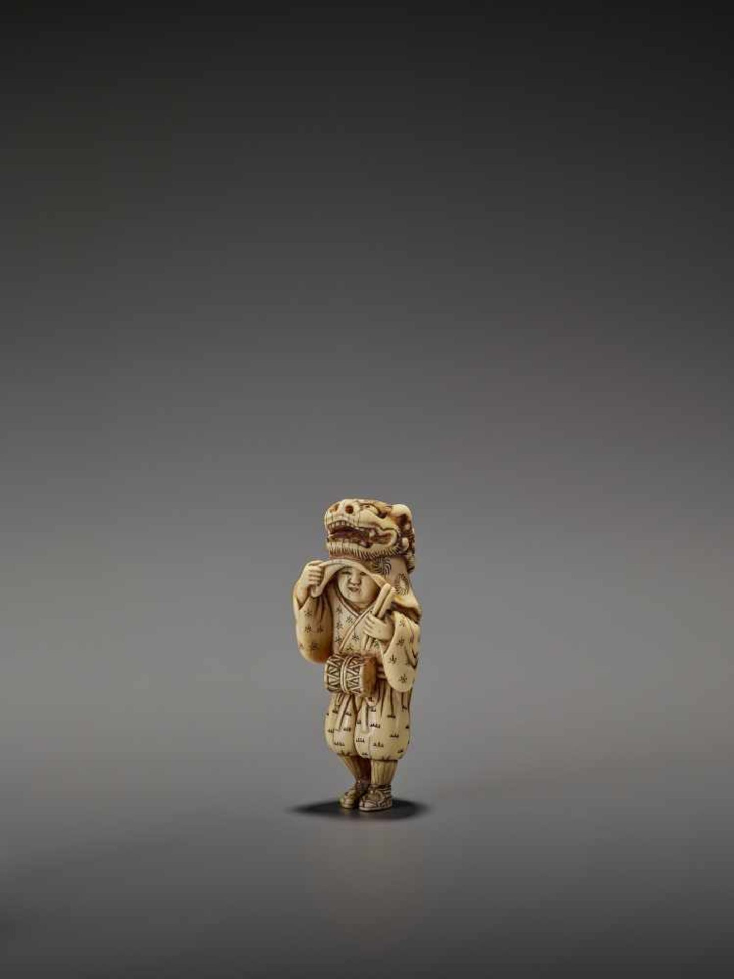 AN EARLY AND FINE IVORY NETSUKE OF A SHISHIMAI DANCER UnsignedJapan, late 18th century, Edo