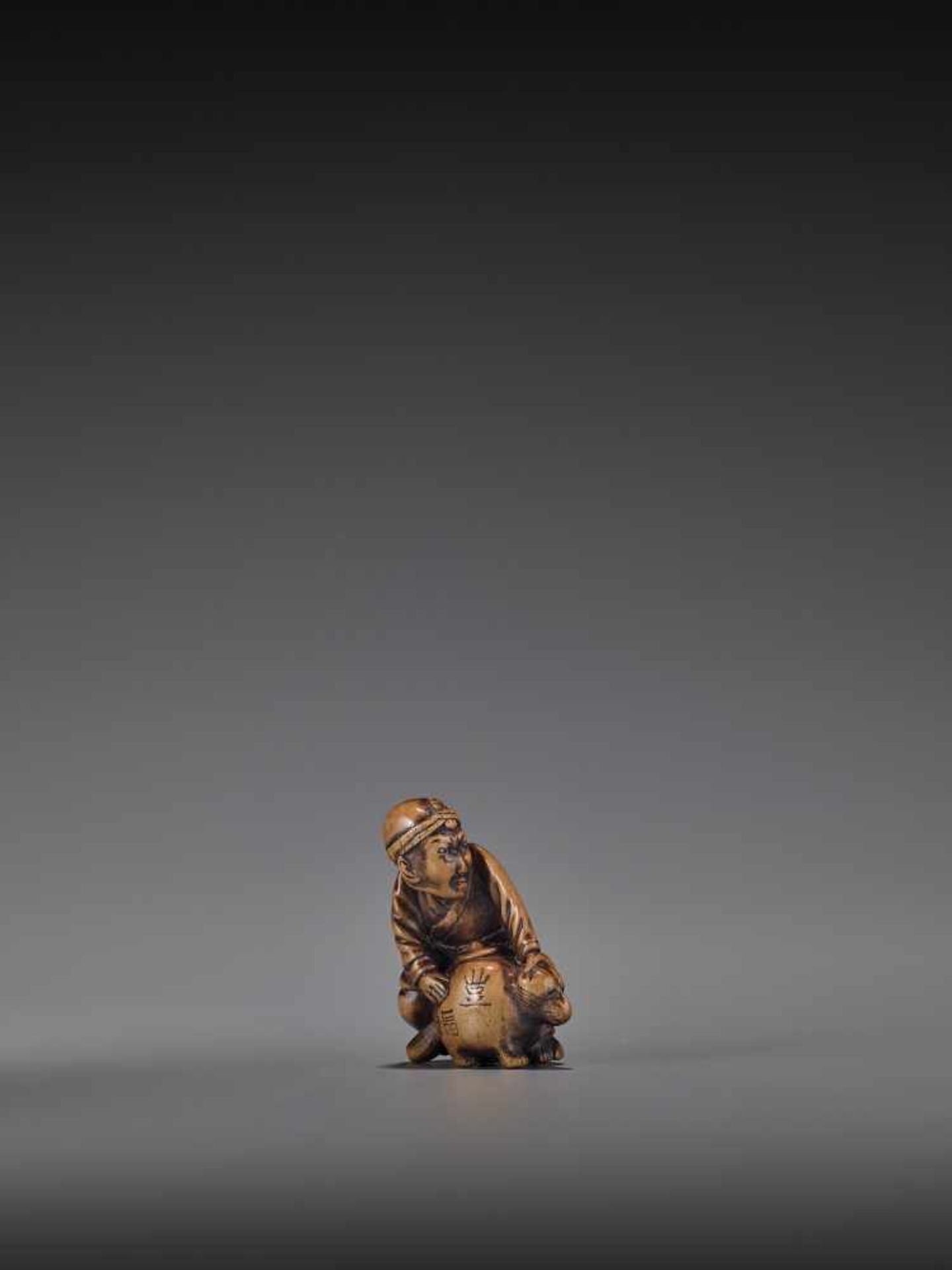 HIDEHISA: A RARE WOOD NETSUKE OF A THIEF STEALING THE MAGIC TANUKI KETTLE By Hidehisa, signed - Image 3 of 12