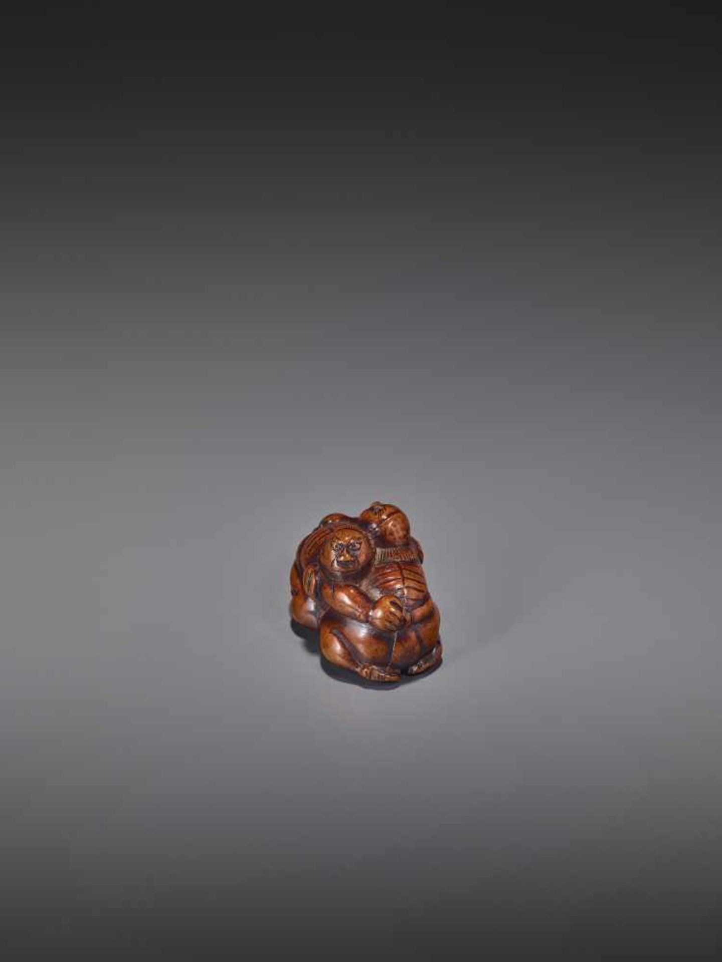 A WOOD NETSUKE OF TWO WRESTLERS UnsignedJapan, early 19th century, Edo period (1615-1868)Carved from