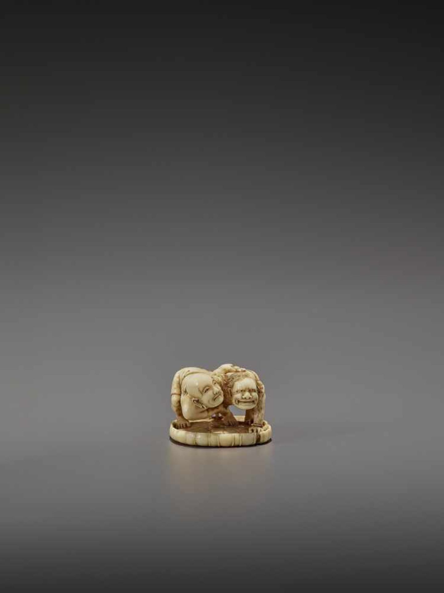 HO RAKUMIN: A FINE IVORY NETSUKE OF JIZO WRESTLING AN ONI By Ho Rakumin, signed Ho Rakumin with - Image 2 of 11