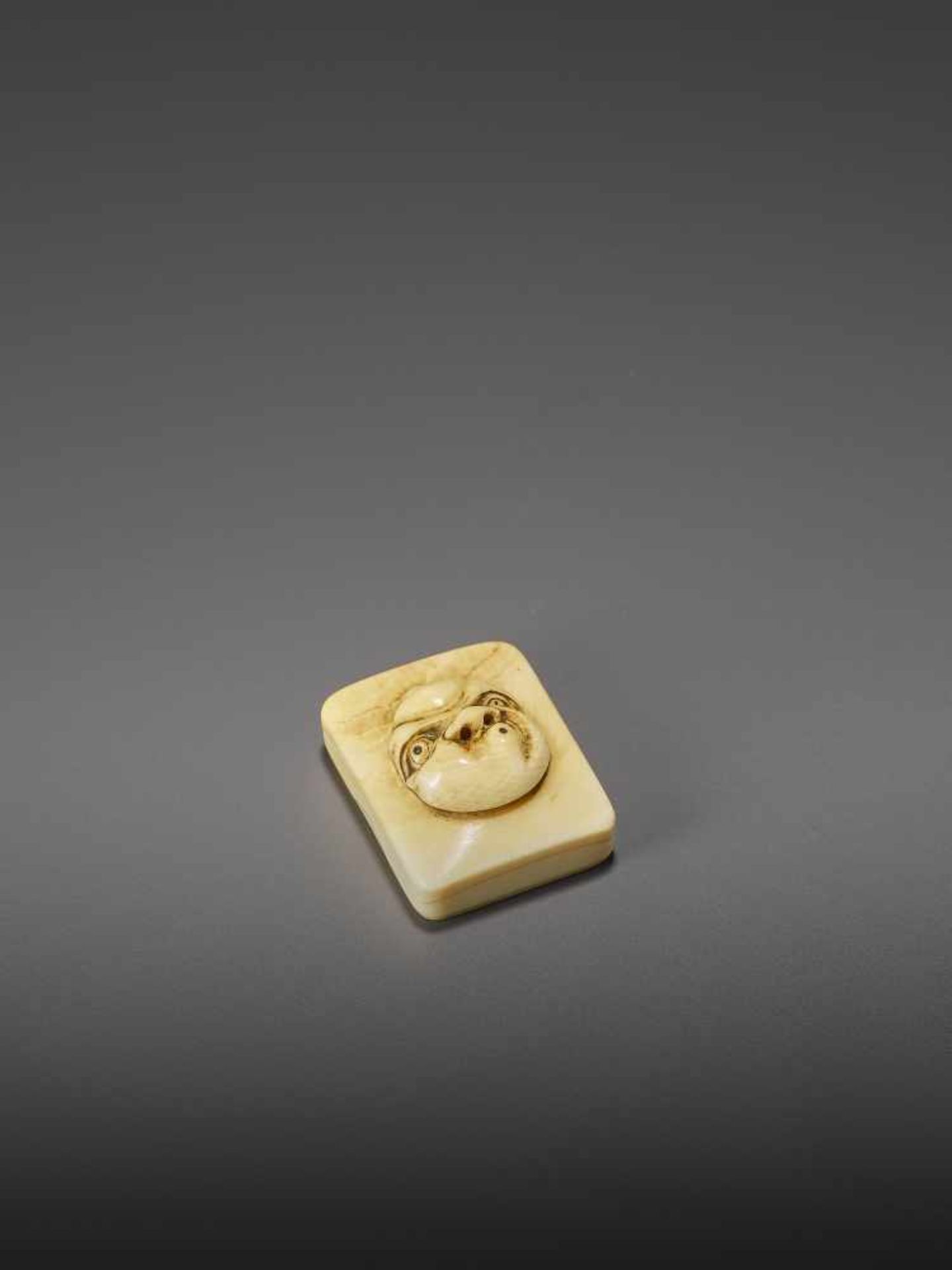 DORAKU: AN IVORY NETSUKE OF A MASK BOX WITH USOFUKI By Doraku(Sai), signed DorakuJapan, Osaka, - Image 9 of 10