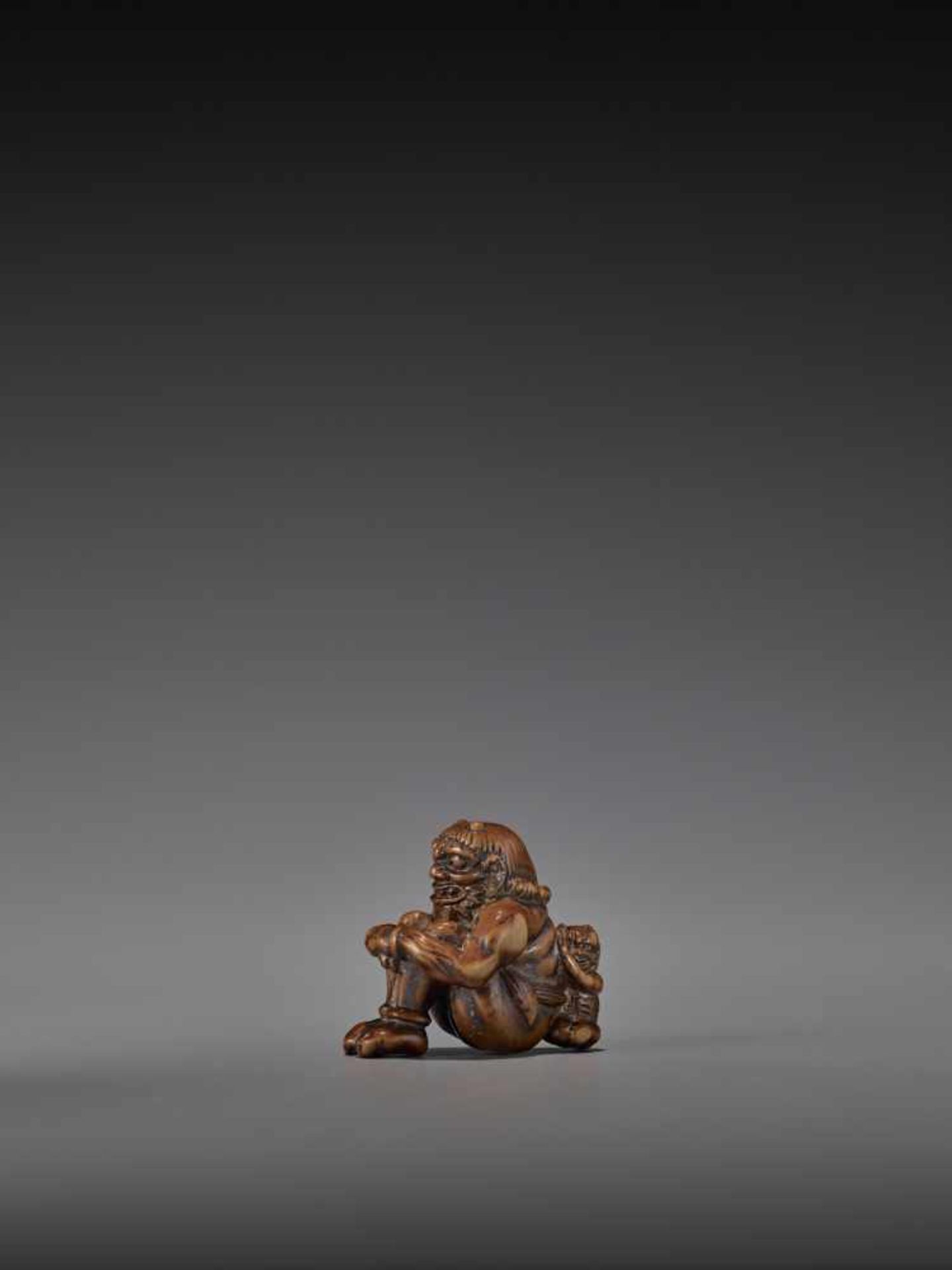 GYOKURIN: AN AMUSING WOOD NETSUKE OF RAIJIN WITH RAITARO By Gyokurin, signed GyokurinJapan, early