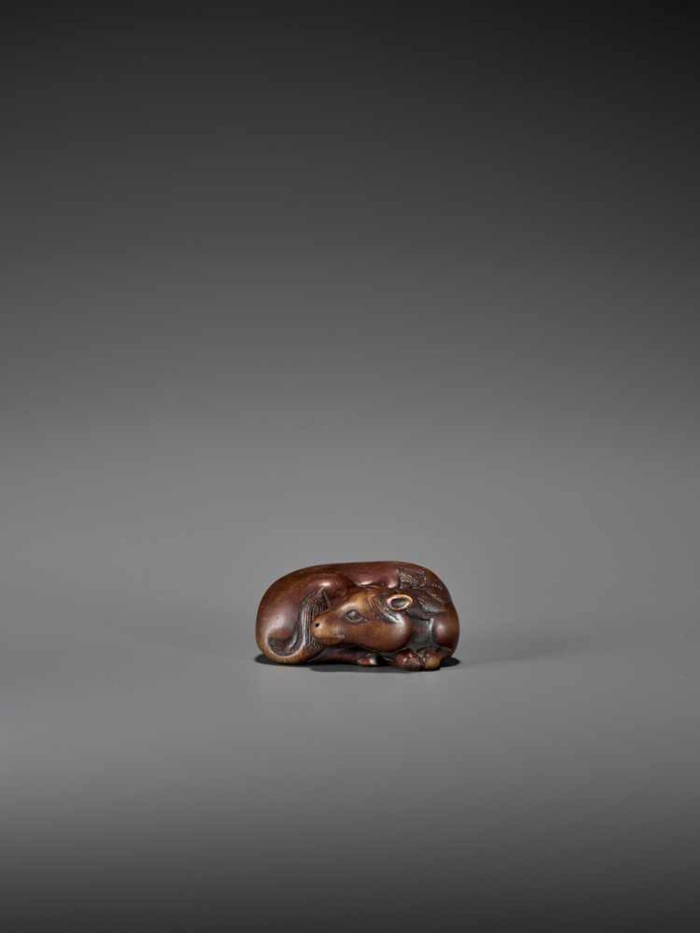 A FINE WOOD NETSUKE OF A RECUMBENT HORSE IN THE MANNER OF TAMETAKA Unsigned, in the manner of - Image 2 of 9