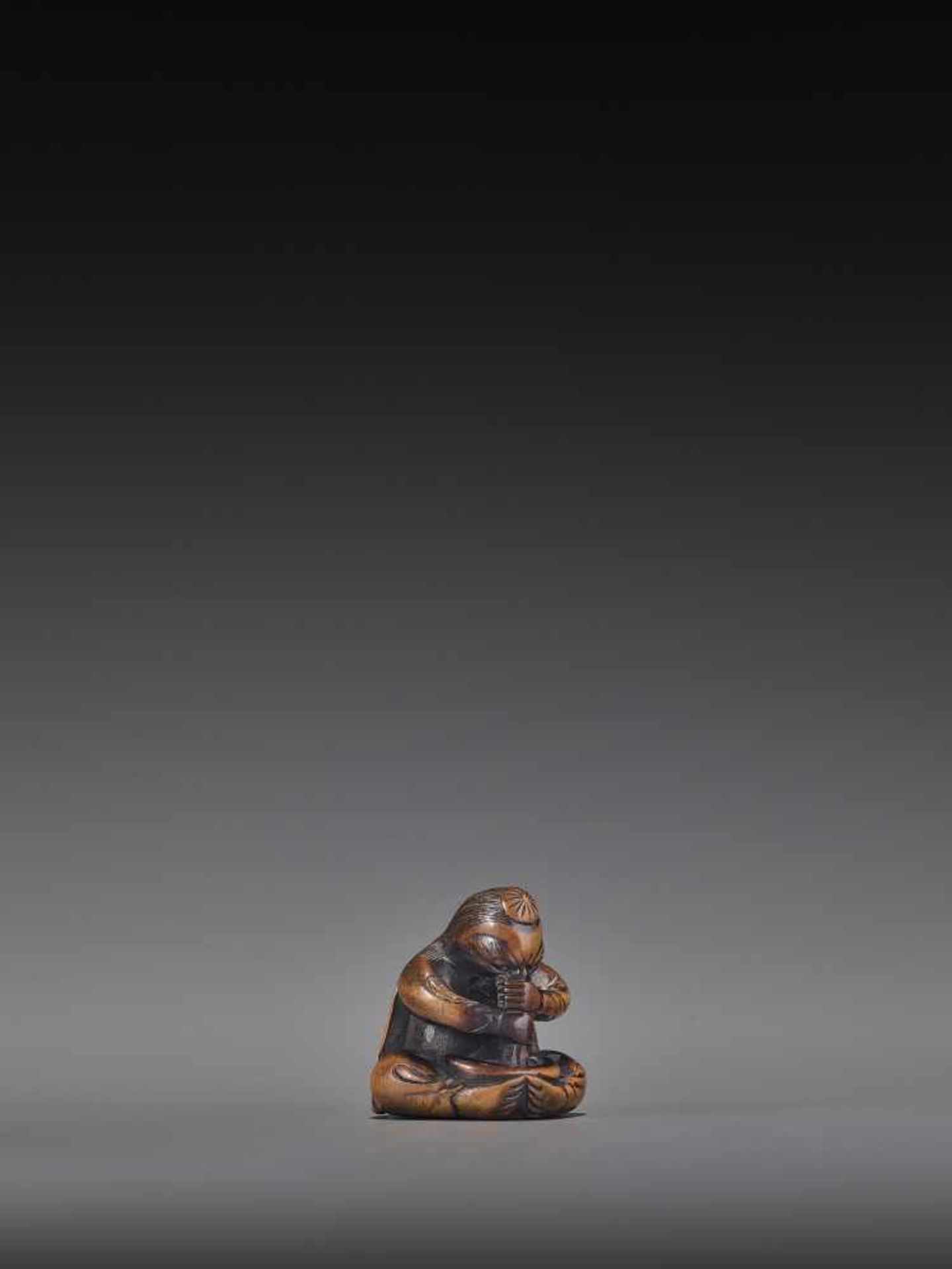 A WOOD NETSUKE OF A TENGU STIRRING MISO UnsignedJapan, 19th century, Edo period (1615-1868)A wood - Image 7 of 9