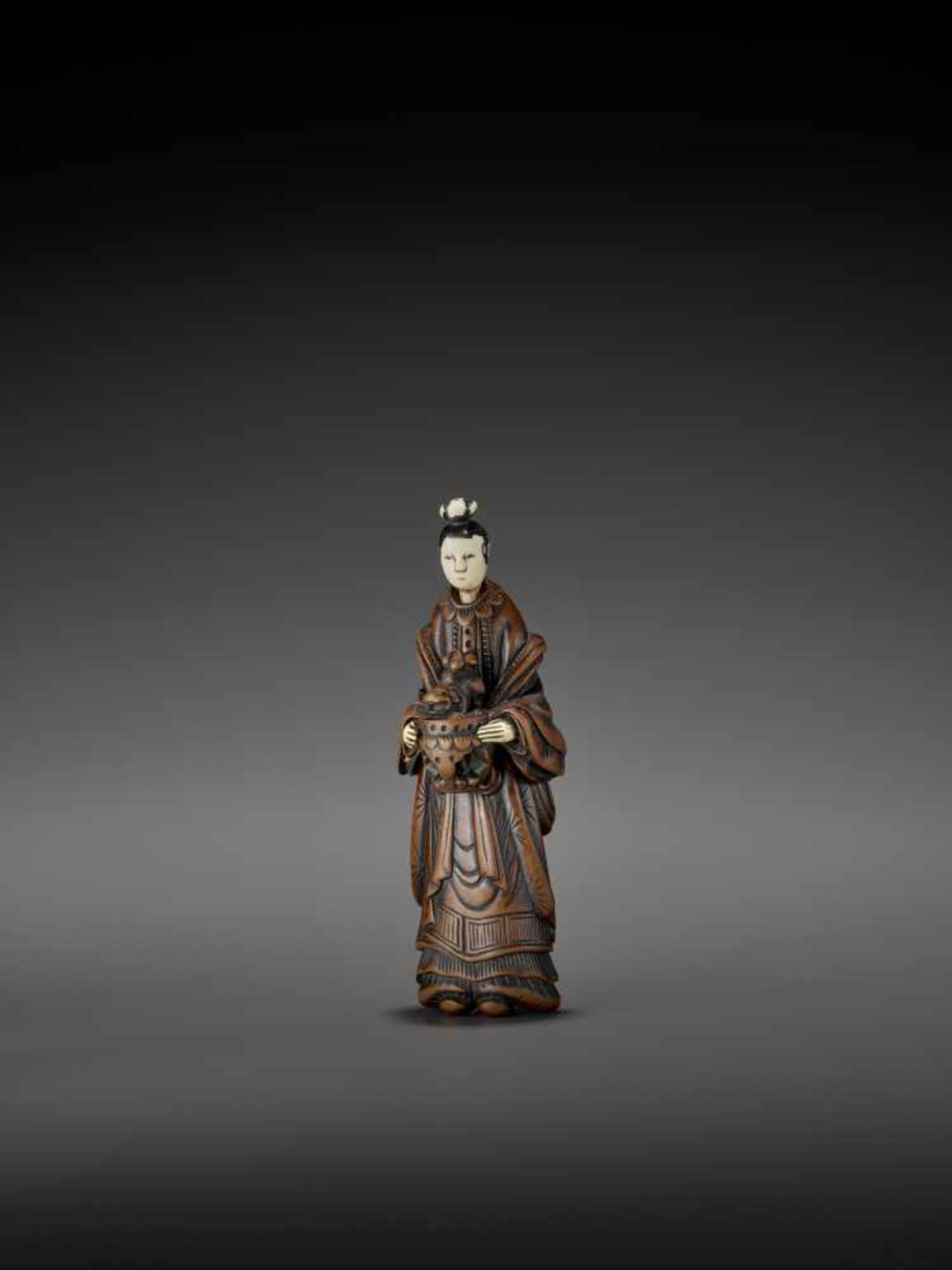 AN IMPORTANT WOOD AND IVORY SHUNGA NETSUKE OF A CHINESE LADY WITH SHISHI CENSER ATTRIBUTED TO