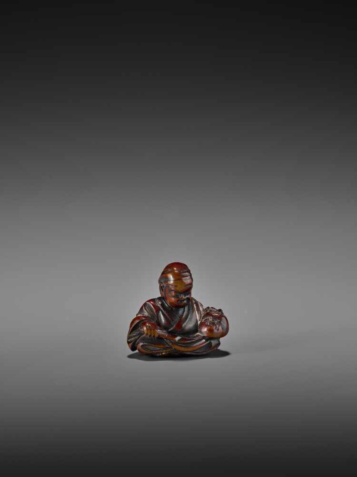 MASAYUKI: A WOOD NETSUKE OF A MASK CARVER IMITATING USOFUKI MASK By Kato Masayuki, signed Masayuki - Bild 2 aus 8