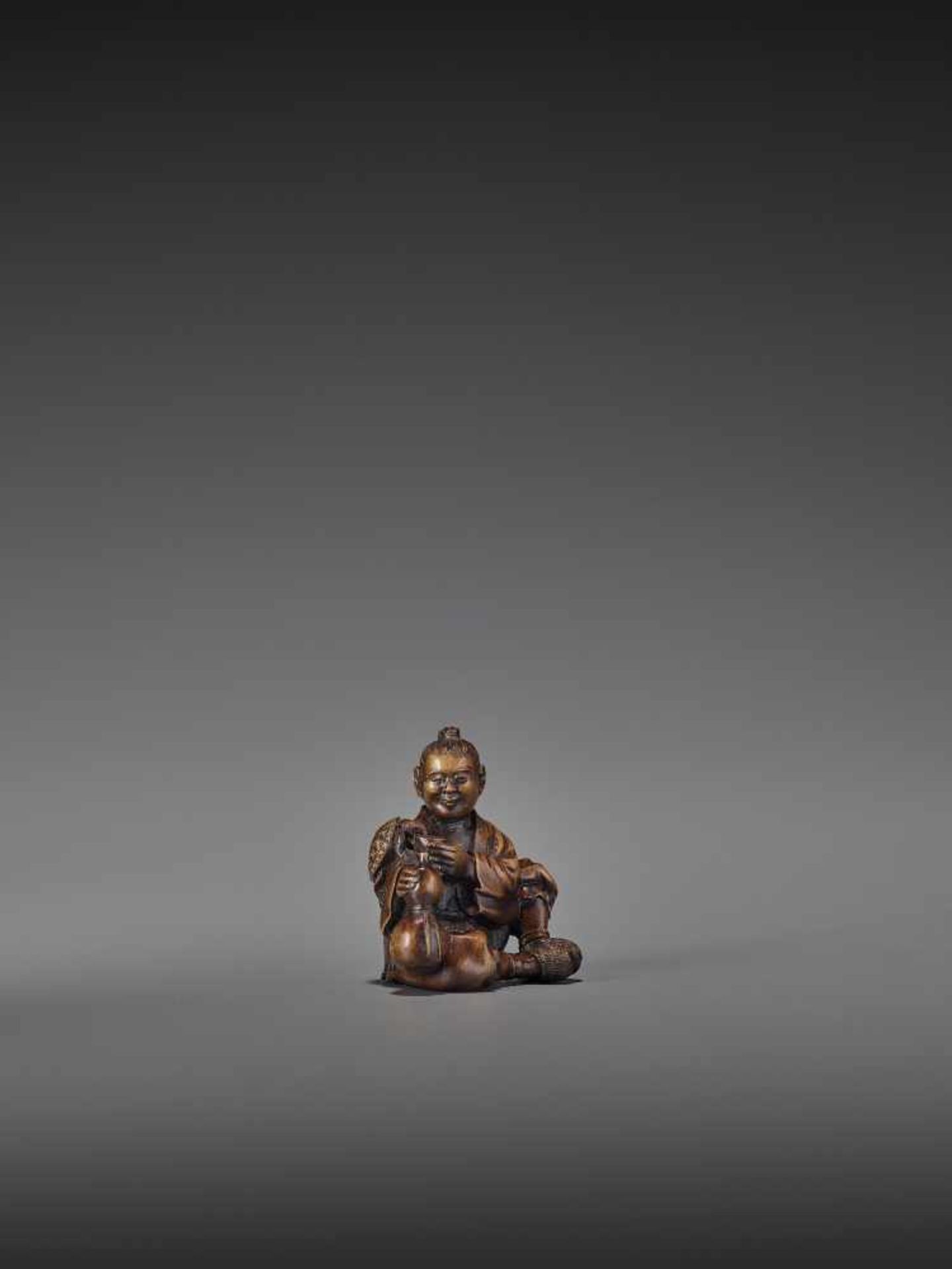 SHOKO: A RARE WOOD NETSUKE OF URASHIMA TARO WITH TURTLE By Shoko, signed ShokoJapan, Takayama,