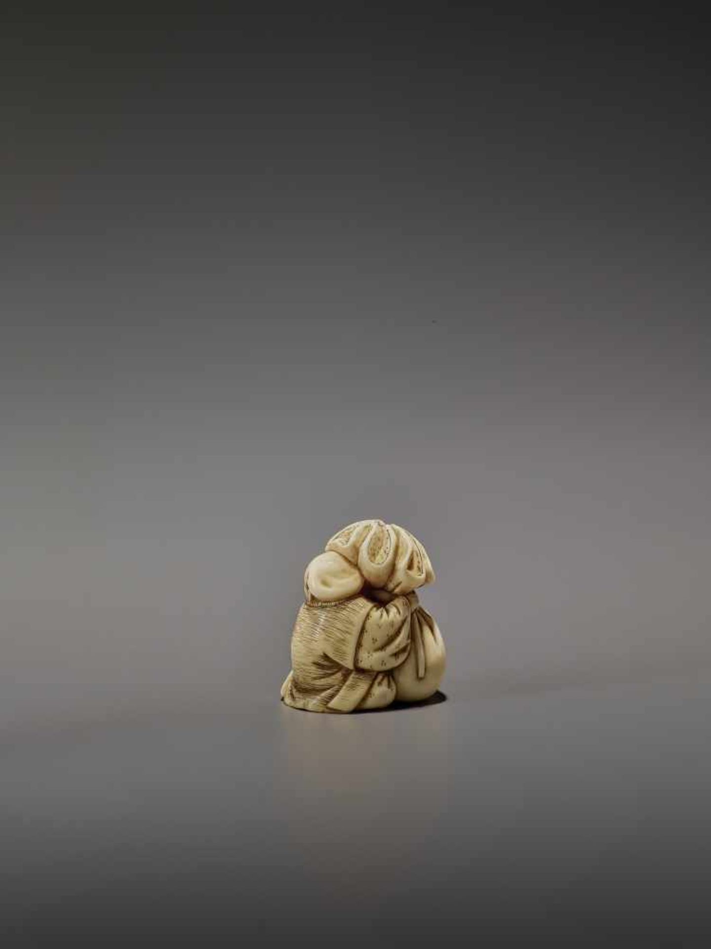 OKURA: A RARE IVORY NETSUKE OF KANNINBUKURO By Ogura Tomoyuki, signed OkuraJapan, Edo, mid-19th - Image 5 of 10