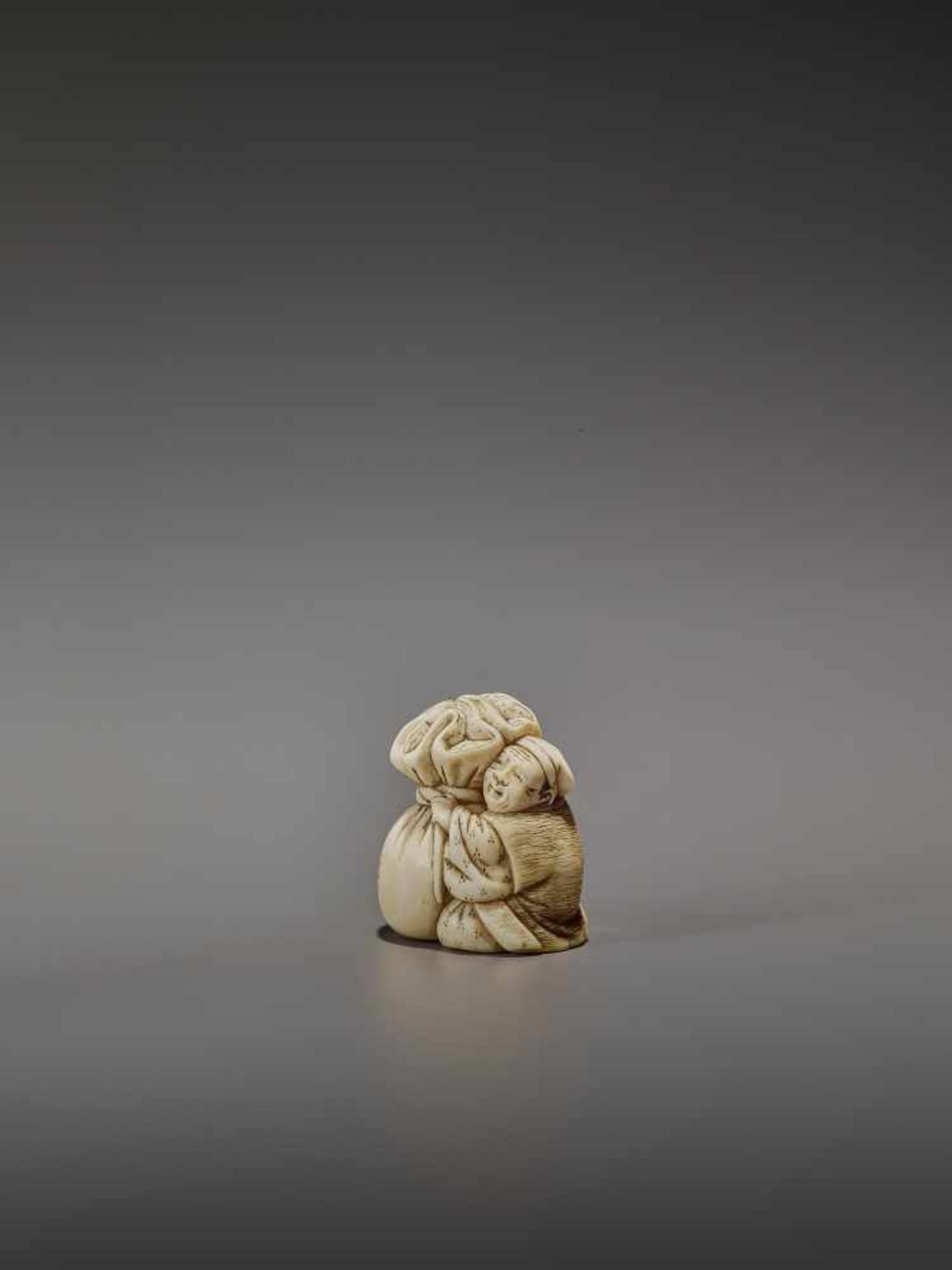 OKURA: A RARE IVORY NETSUKE OF KANNINBUKURO By Ogura Tomoyuki, signed OkuraJapan, Edo, mid-19th - Image 3 of 10