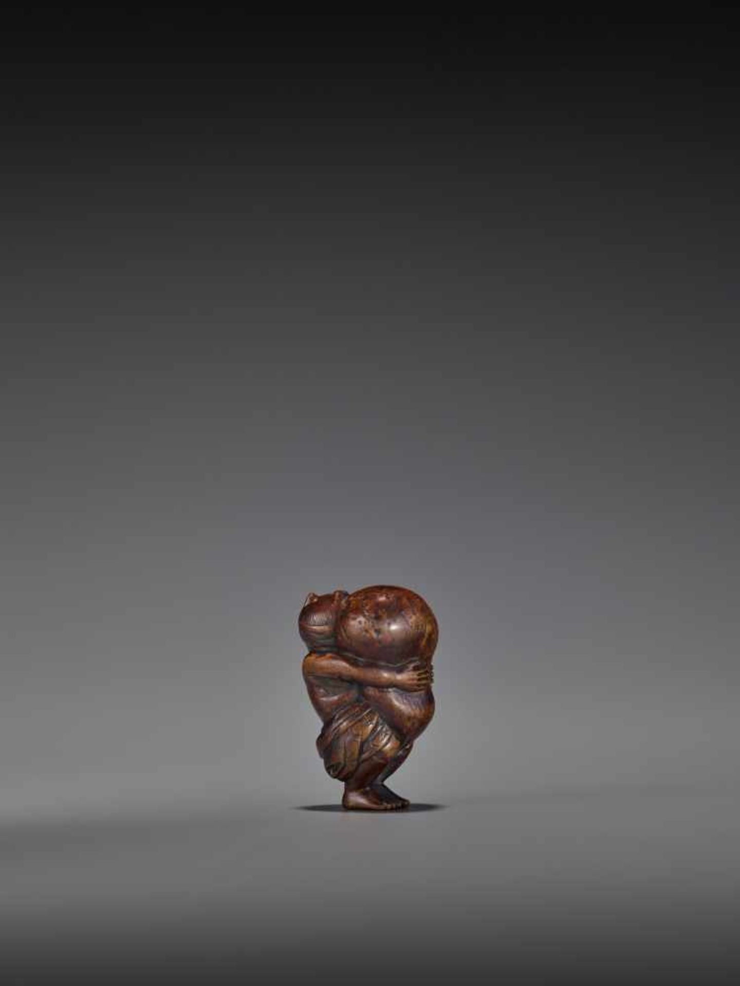 TOMOMASA: AN AMUSING WOOD NETSUKE OF A TANUKI WITH GIANT SCROTUM By Tomomasa, signed - Image 4 of 8