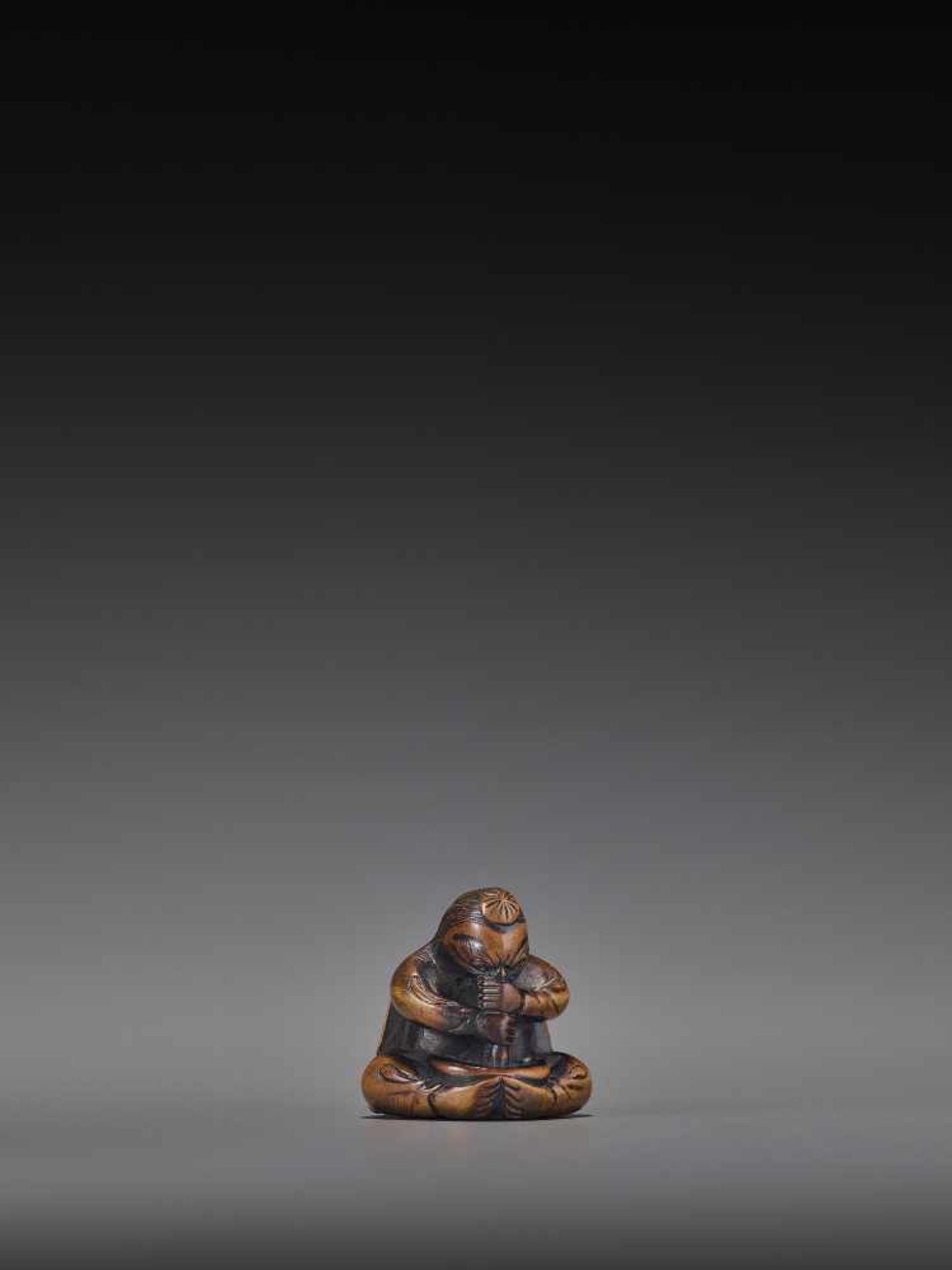 A WOOD NETSUKE OF A TENGU STIRRING MISO UnsignedJapan, 19th century, Edo period (1615-1868)A wood - Image 8 of 9