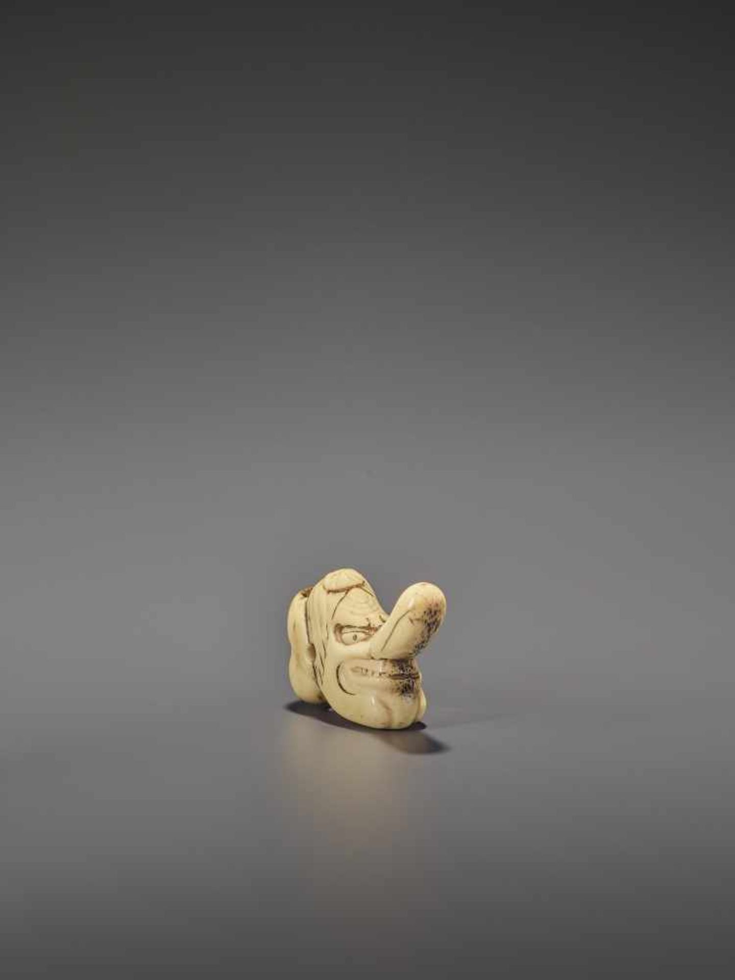 A RARE STAG ANTLER SHUNGA NETSUKE OF OKAME AND TENGU MASKS UnsignedJapan, 19th century, Edo - Image 8 of 10