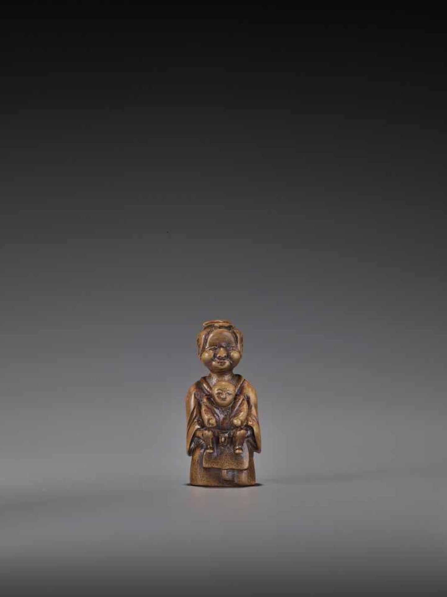 A RARE WOOD ‘DOUBLE SHUNGA’ NETSUKE OF A MOTHER AND CHILD UnsignedJapan, 18th century, Edo period (