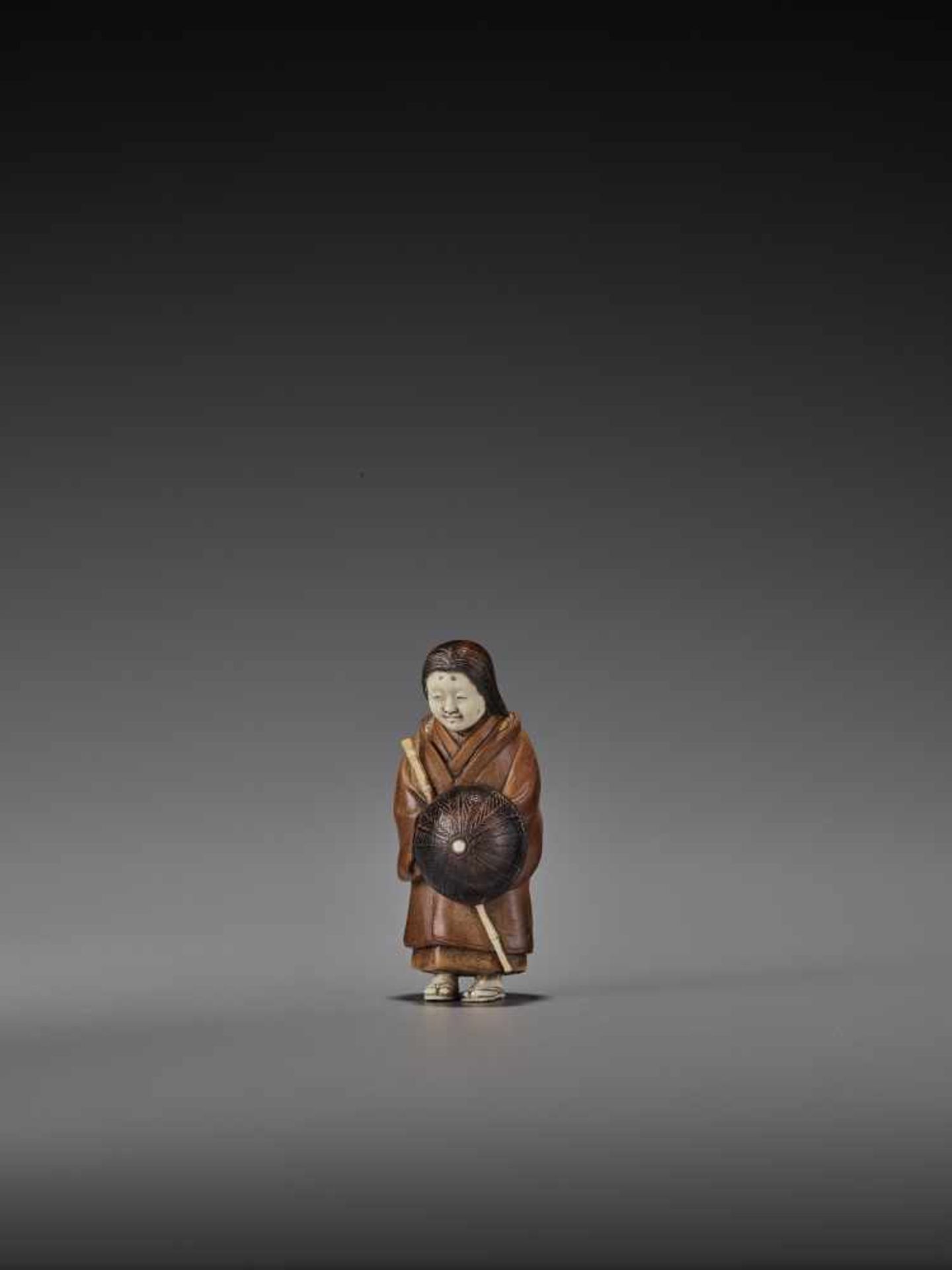 RAKUMIN: A RARE WOOD AND IVORY NETSUKE OF A VISITING COURTESAN By Ho Rakumin, signed RakuminJapan, - Image 4 of 10