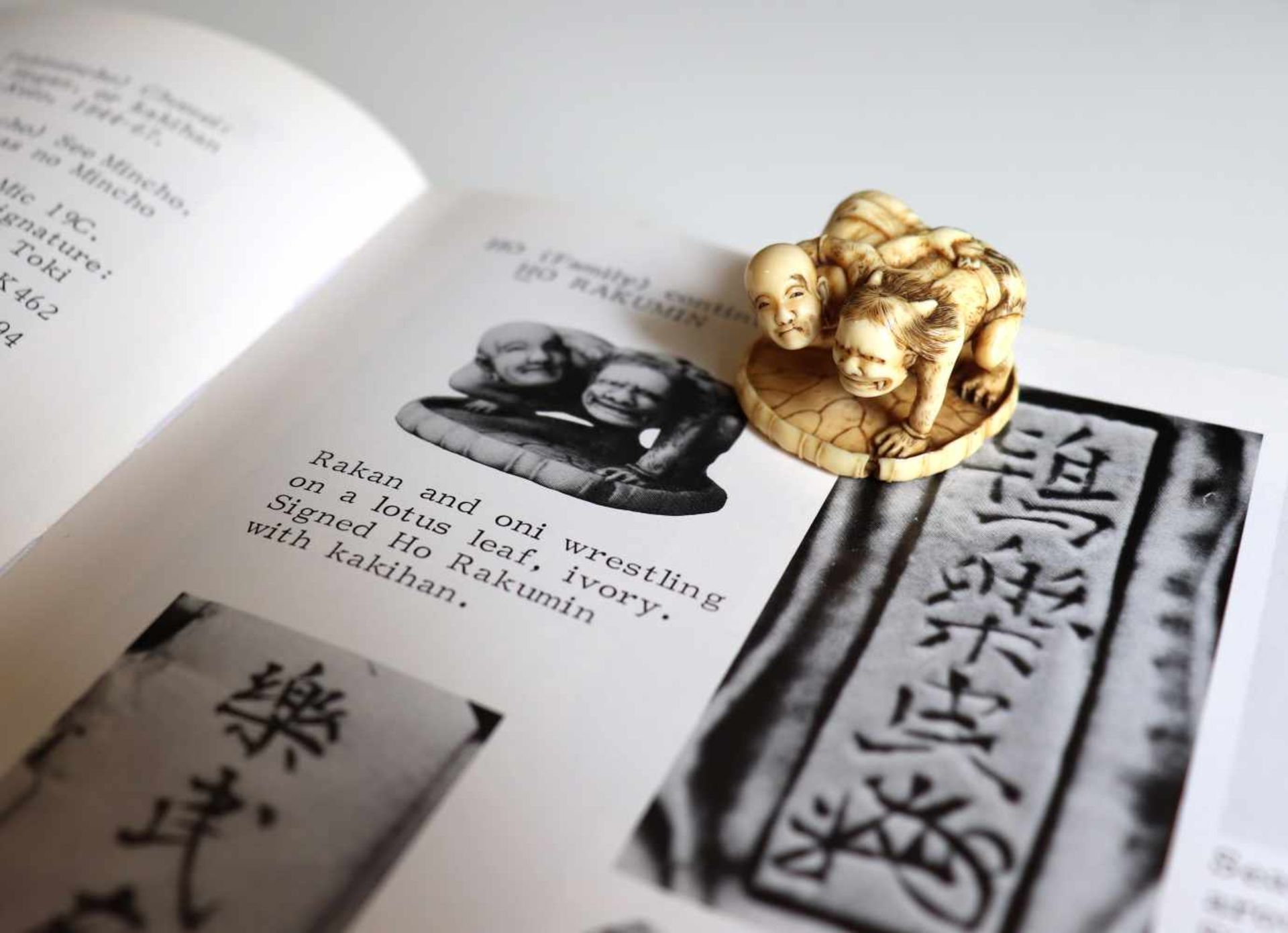 HO RAKUMIN: A FINE IVORY NETSUKE OF JIZO WRESTLING AN ONI By Ho Rakumin, signed Ho Rakumin with - Image 10 of 11