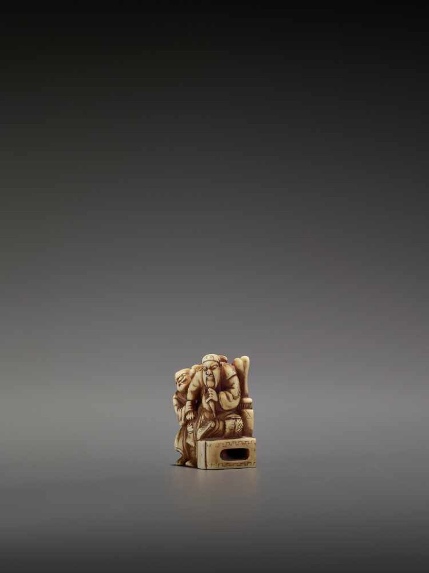 KINRYUSAI: AN IVORY NETSUKE OF KAN’U BEING MASSAGED BY A BLIND MAN By Kinryusai, signed Kinryusai - Image 3 of 10