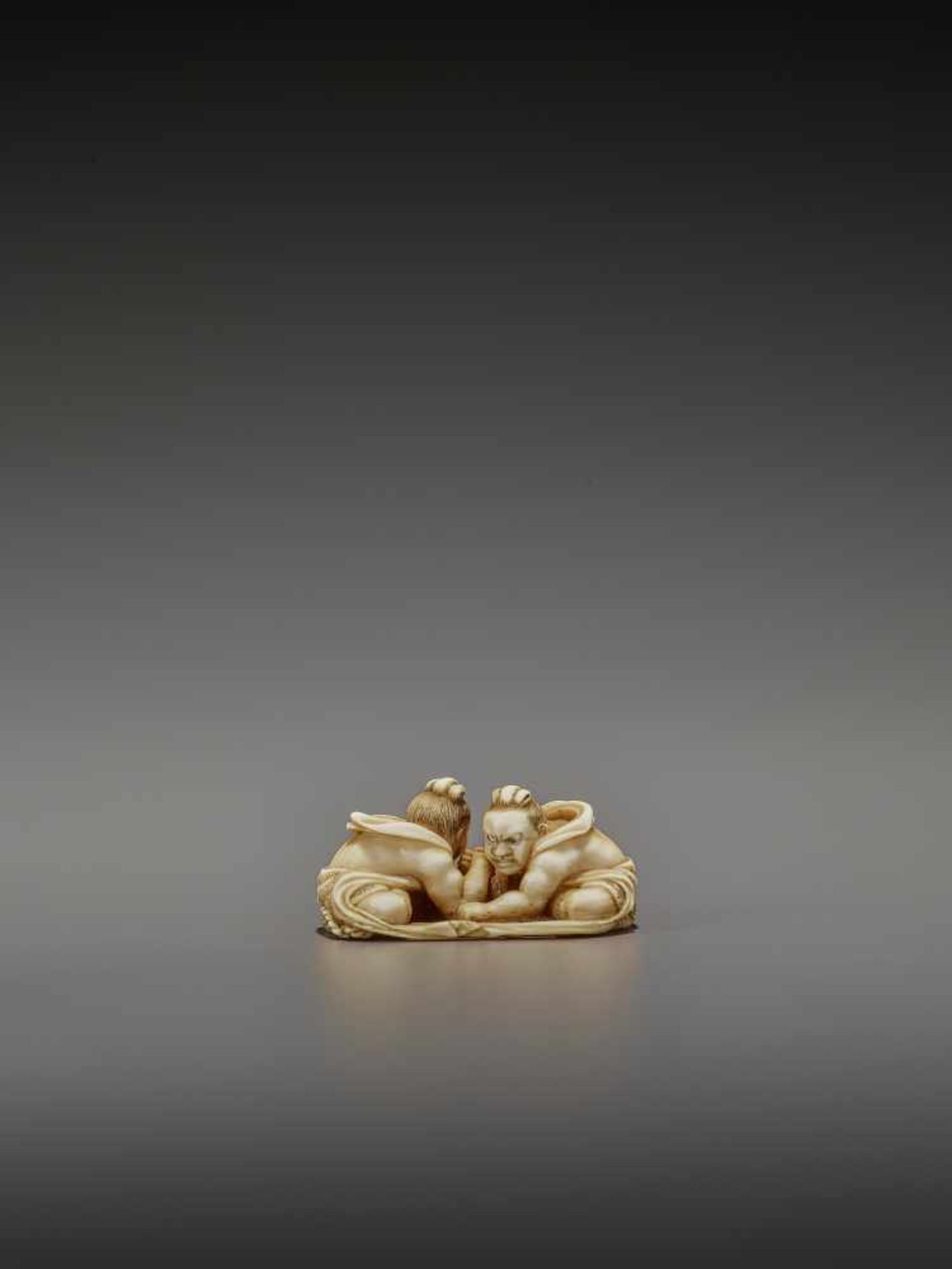 TOMOTAKA: AN IVORY NETSUKE OF TWO ARMWRESTLING NIO ON A WARAJI By Tomotaka, signed TomotakaJapan, - Image 8 of 11