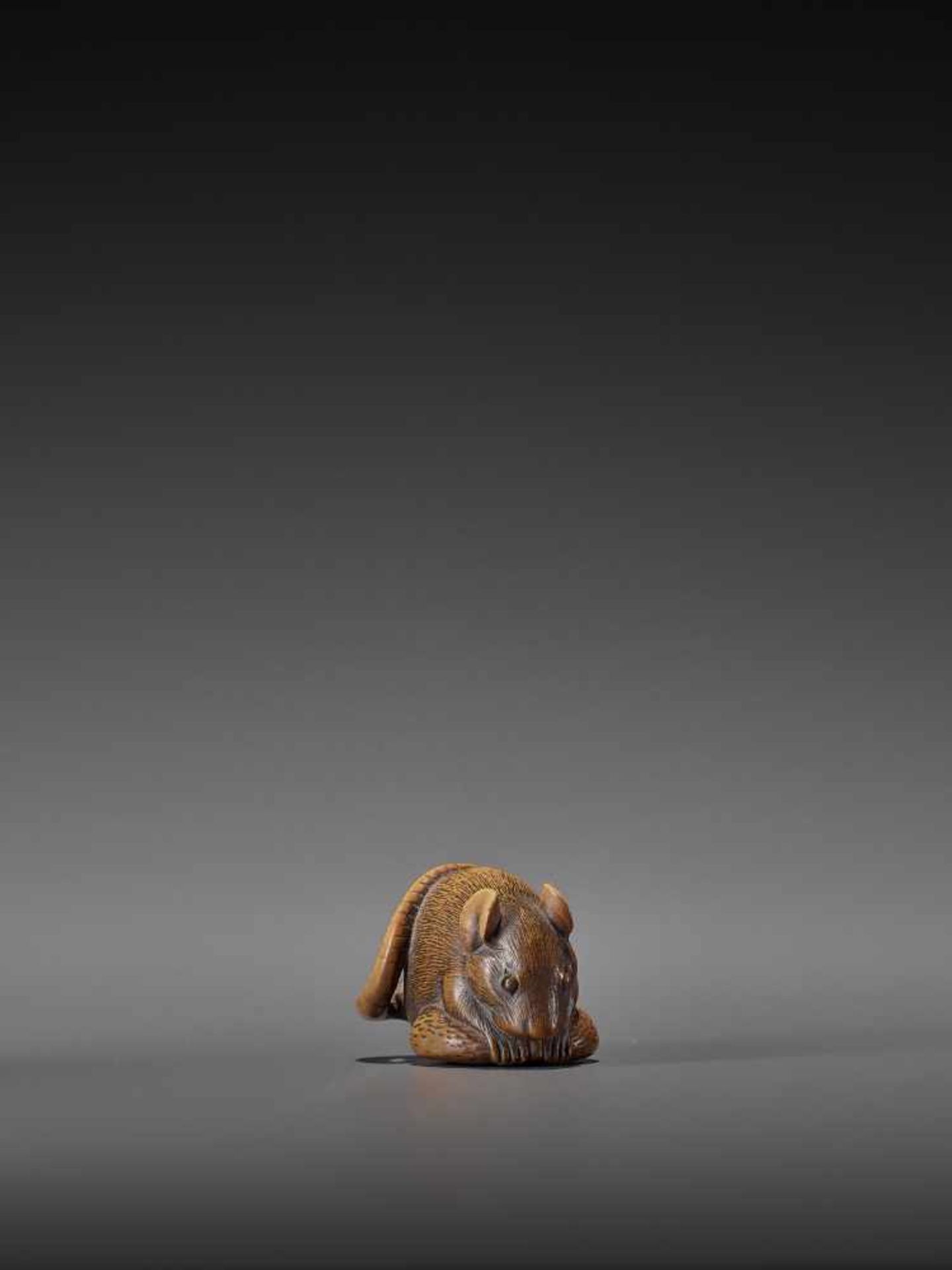 A WOOD NETSUKE OF A RAT WITH CHESTNUT UnsignedJapan, 19th century, Edo period (1615-1868)A