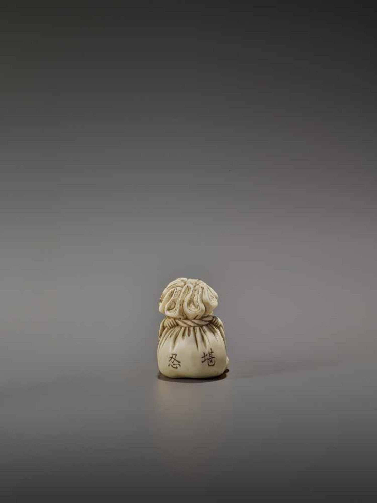 OKURA: A RARE IVORY NETSUKE OF KANNINBUKURO By Ogura Tomoyuki, signed OkuraJapan, Edo, mid-19th - Image 7 of 10