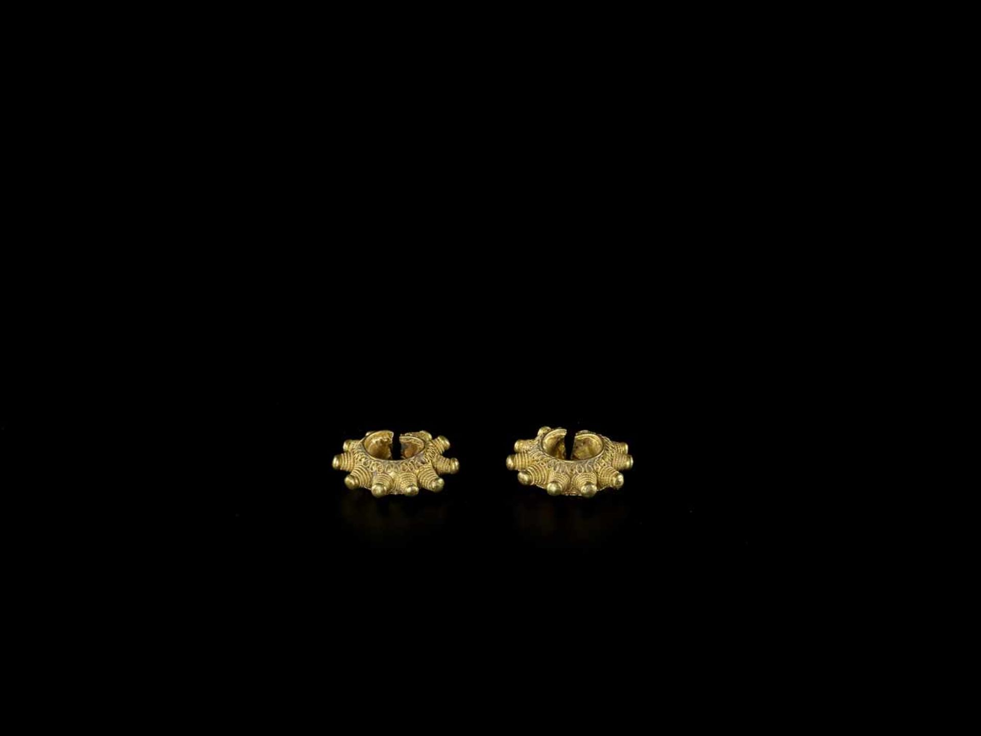 A PAIR OF GOLD EAR ORNAMENTS WITH ELABORATE GOLD THREAD DECORATIONS South East Asian Archipelago,