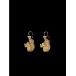 A PAIR OF CHAM REPOUSSÉ GOLD EAR ORNAMENTS IN THE FORM OF MAKARA Champa, Thap Mam Style, 12th – 14th