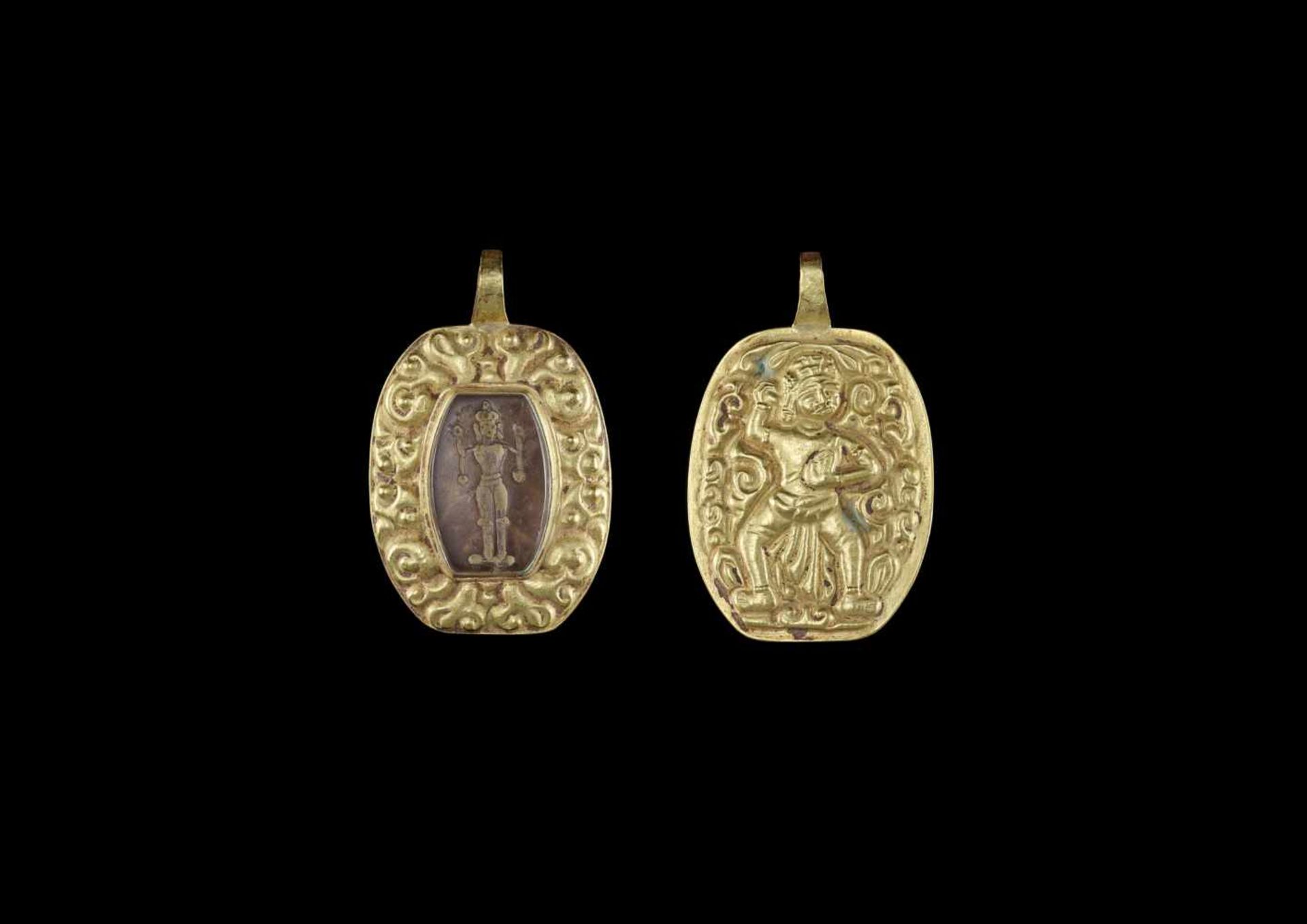 A CHAM REPOUSSÉ GOLD PENDANT WITH STONE INTAGLIO Champa, early classical period, 8th – 10th century.