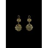 A PAIR OF BALL-SHAPED CHAM REPOUSSÉ GOLD EAR ORNAMENTS WITH LION HEADS Champa, classical period,