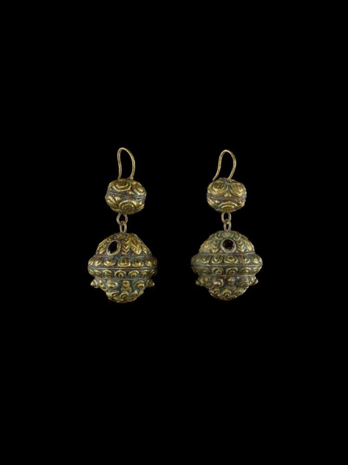 A PAIR OF BALL-SHAPED CHAM REPOUSSÉ GOLD EAR ORNAMENTS WITH LION HEADS Champa, classical period,