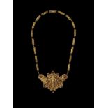 A CHAM REPOUSSÉ GOLD NECKLACE WITH A PECTORAL DEPICTING UMA Central Cham kingdom, classical