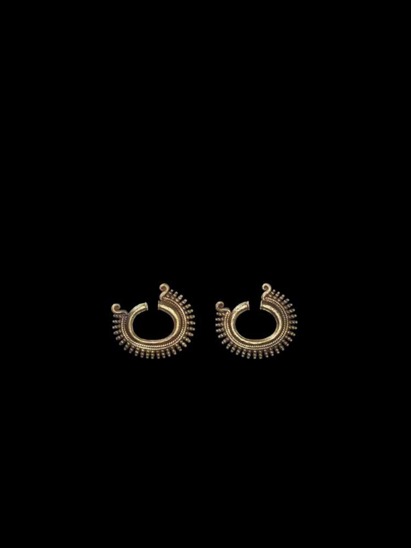 A PAIR OF OPEN RING-SHAPED MINDANAO GOLD EAR ORNAMENTS Philippines, Mindanao, 8th – 13th century.