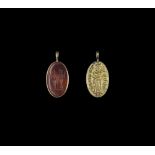 A CHAM REPOUSSÉ GOLD PENDANT WITH STONE INTAGLIO DEPICTING TWO HINDU DEITIES Champa, classical